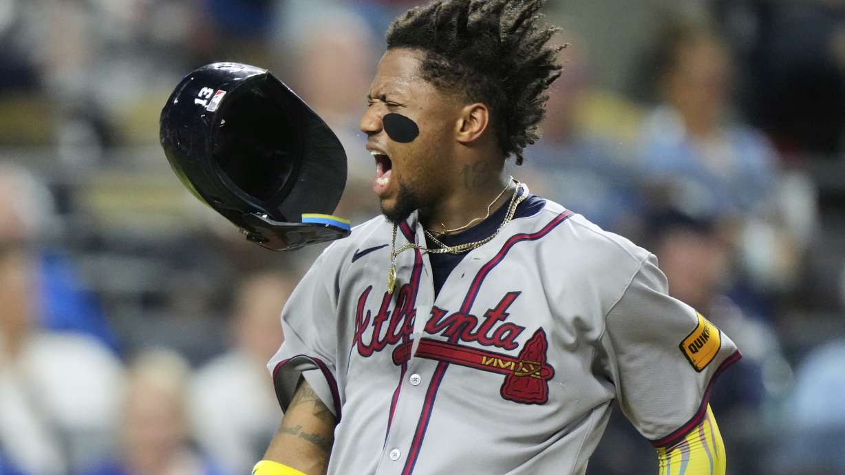 Atlanta Braves' Ronald Acuna Jr. celebrates after scoring on a three-run double hit by Austin Riley during the eighth inning of a baseball game against the Kansas City Royals, Monday, July 28, 2025, in Kansas City, Mo.