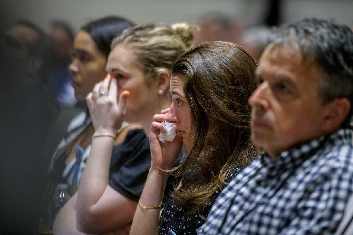 Family members of the victims of American Airlines flight 5342 who perished in a collision with a U.S. military helicopter, listen to opening statements during the NTSB fact-finding hearing on the DCA midair collision accident, at the National Transportation and Safety Board boardroom, Wednesday in Washington.