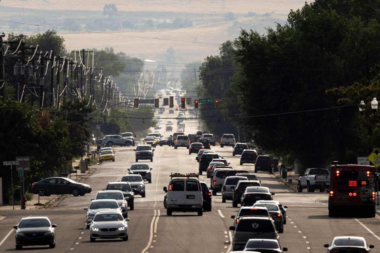 Traffic flows along 3500 South in West Valley City on July 15. Christy Goldfuss, executive director of the Natural Resources Defense Council, said the EPA's proposed rollback of tailpipe emission standards will worsen climate impacts and endanger human health and welfare.