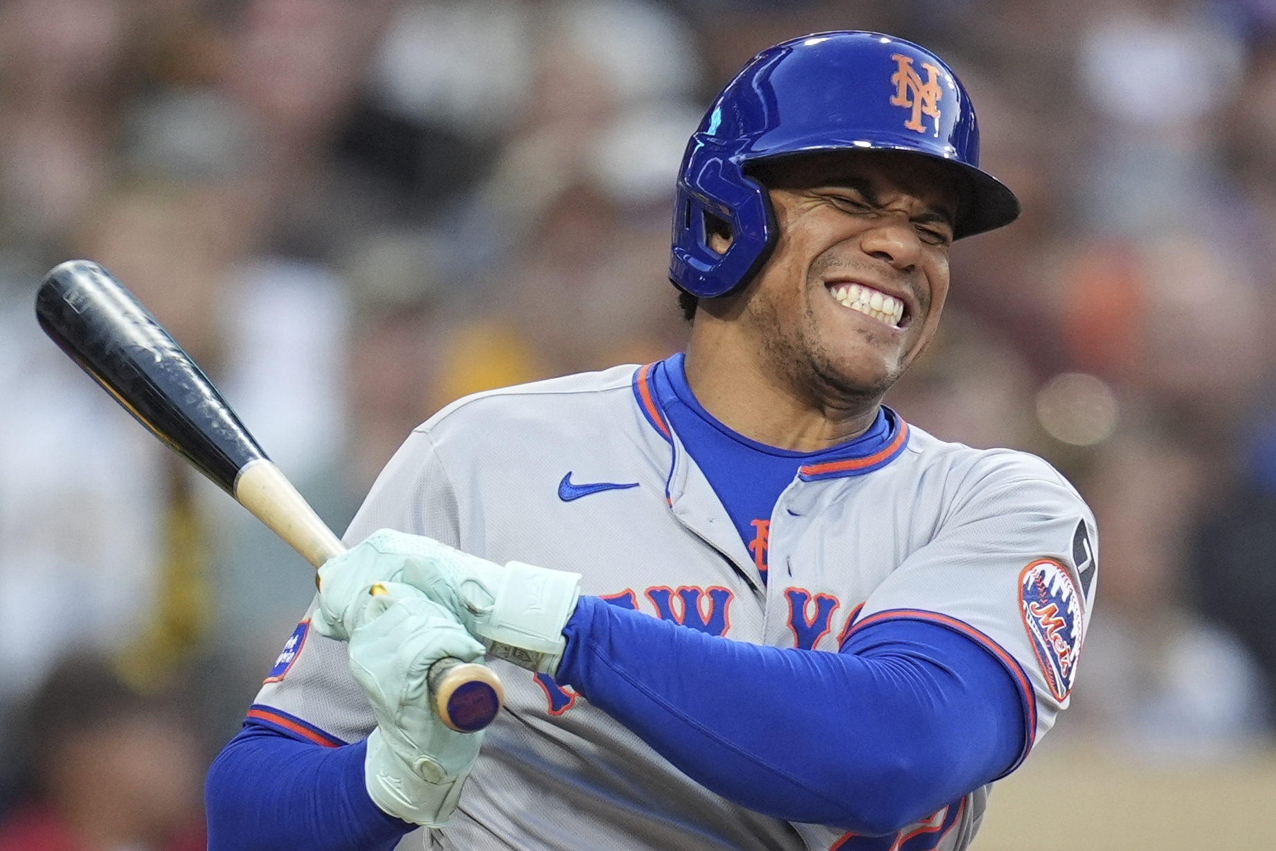 New York Mets' Juan Soto reacts after fouling a ball off his leg while batting during the fourth inning of a baseball game against the San Diego Padres Tuesday, July 29, 2025, in San Diego.