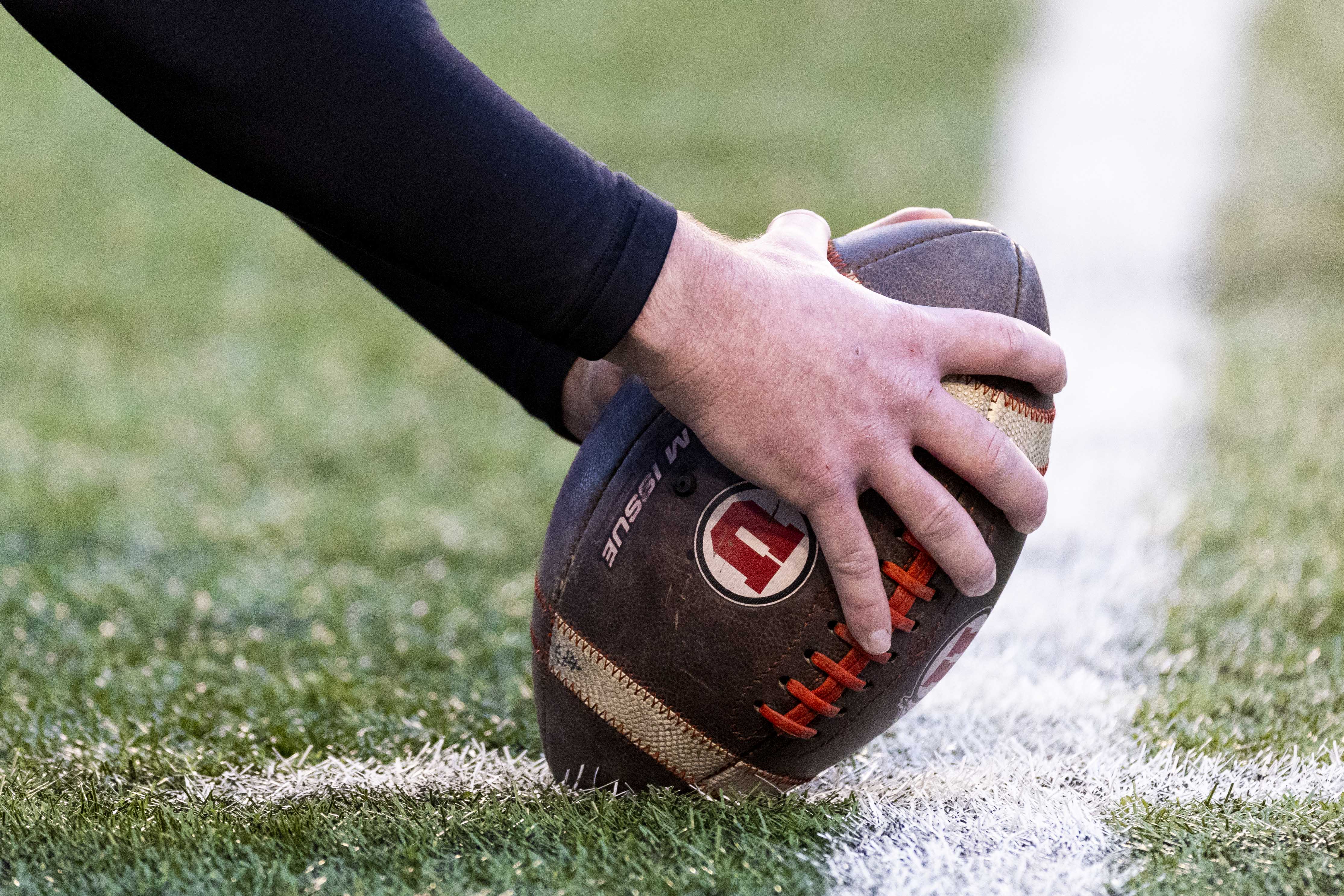 A player prepares to snap the ball during warmups before an NCAA football game between the University of Utah Utes and the Iowa State University Cyclones held at Rice-Eccles Stadium in Salt Lake City, Nov. 23, 2024.