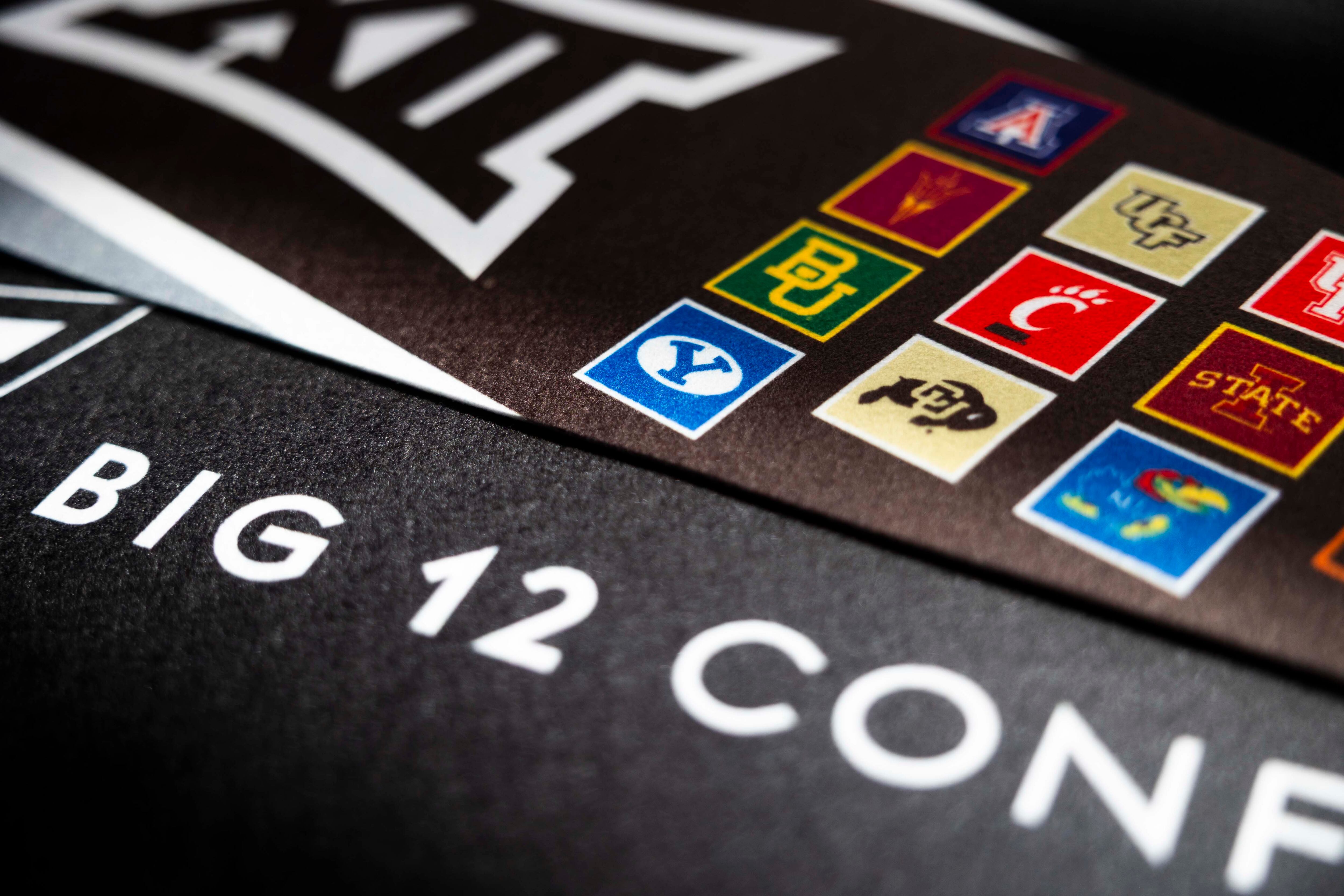 A Big 12 pendant with a BYU logo is sold at the T-Mobile Center during the Big 12 Championship in Kansas City, Mo., March 11.