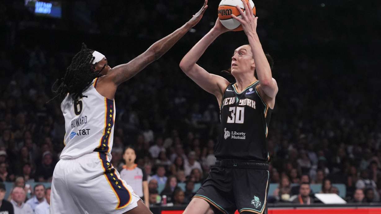 New York Liberty's Breanna Stewart (30) shoots over Indiana Fever's Natasha Howard (6) during the first half of a WNBA basketball game Wednesday, July 16, 2025, in New York.