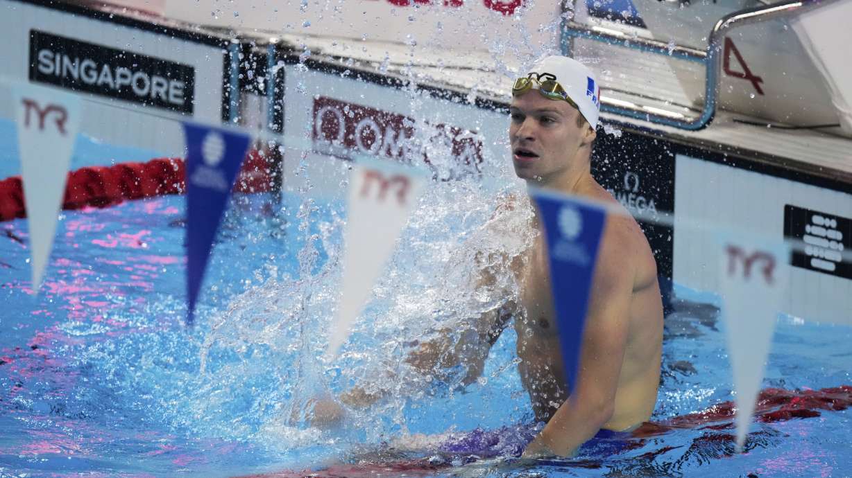Leon Marchand of France reacts after competing in the men's 200-meter individual medley semifinals at the World Aquatics Championships in Singapore, Wednesday, July 30, 2025.