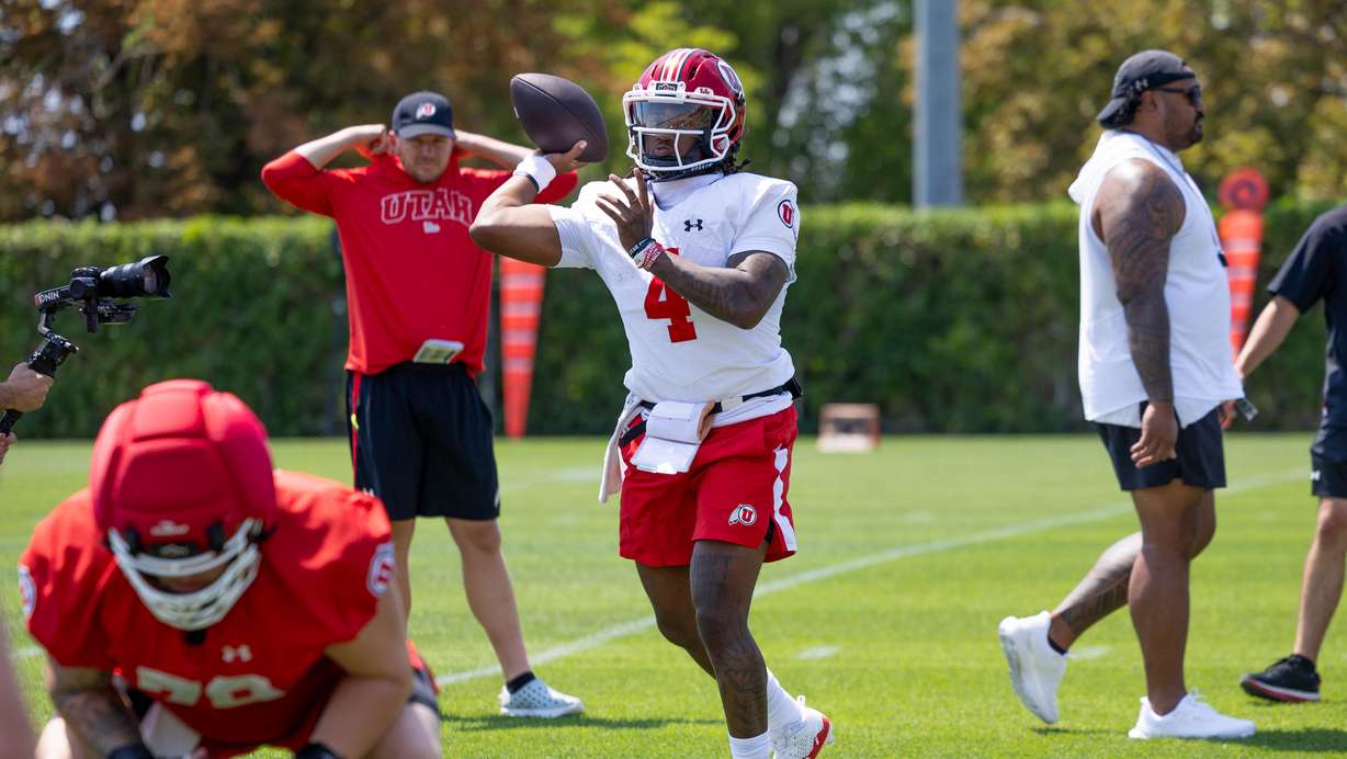 Utah quarterback Devon Dampier goes through passing drills during the team's first day of fall camp on July 30, 2025.