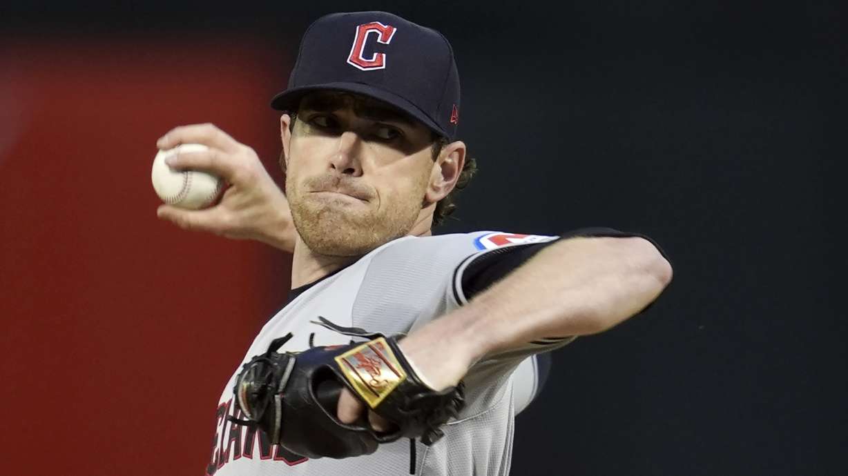 FILE - Cleveland Guardians pitcher Shane Bieber throws to an Oakland Athletics batter during the first inning of a baseball game, Thursday, March 28, 2024, in Oakland, Calif.