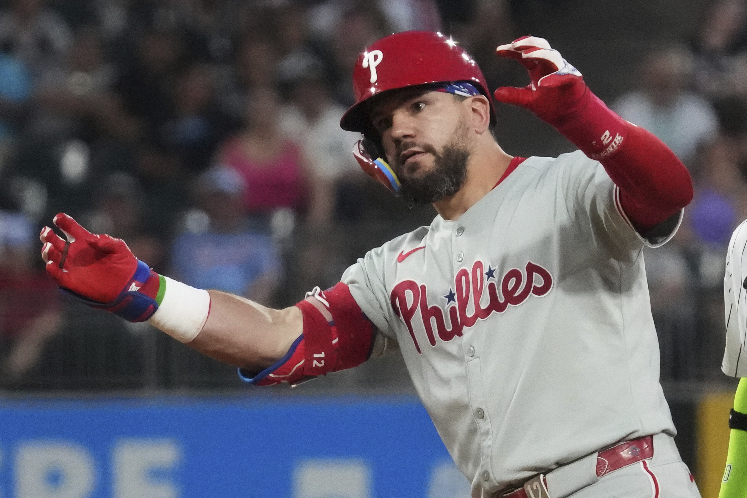 Philadelphia Phillies' Kyle Schwarber celebrates after hitting a double during the seventh inning of a baseball game against the Chicago White Sox in Chicago, Tuesday, July 29, 2025. 