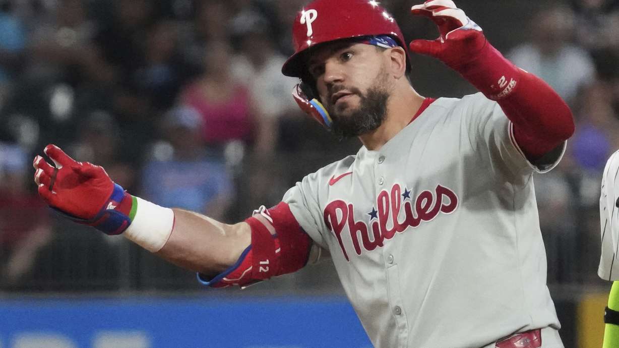 Philadelphia Phillies' Kyle Schwarber celebrates after hitting a double during the seventh inning of a baseball game against the Chicago White Sox in Chicago, Tuesday, July 29, 2025.