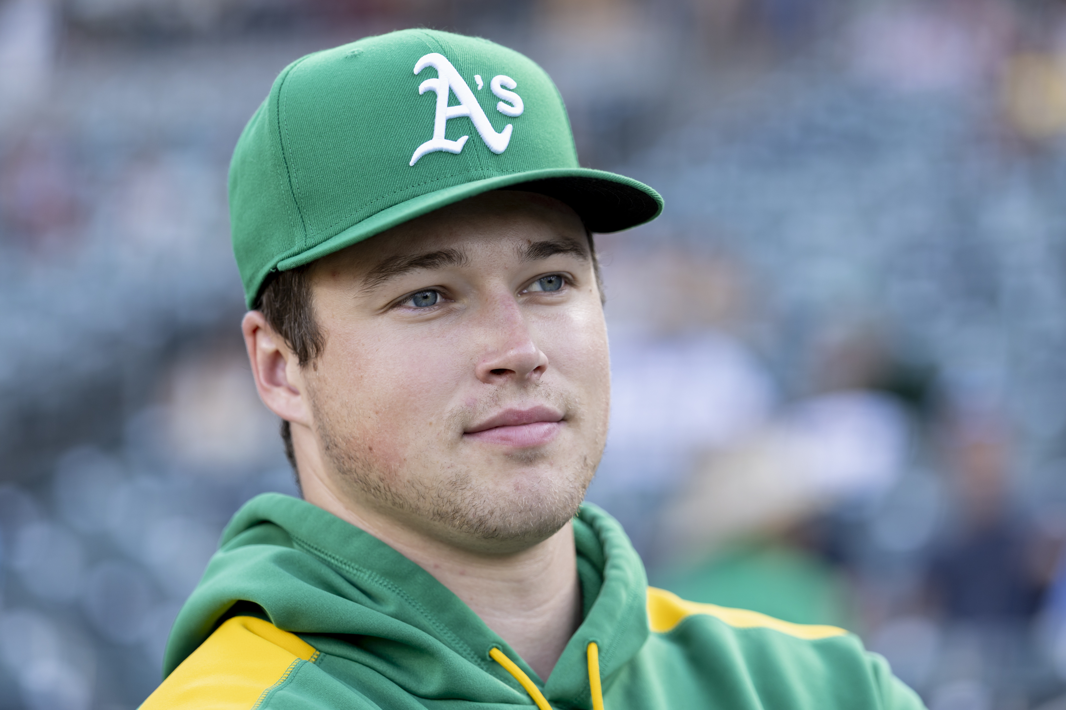 Athletics pitcher Mason Miller looks to the field before a baseball game against the Toronto Blue Jays, Friday, July 11, 2025, in West Sacramento, Calif. 
