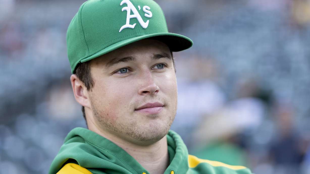 Athletics pitcher Mason Miller looks to the field before a baseball game against the Toronto Blue Jays, Friday, July 11, 2025, in West Sacramento, Calif.