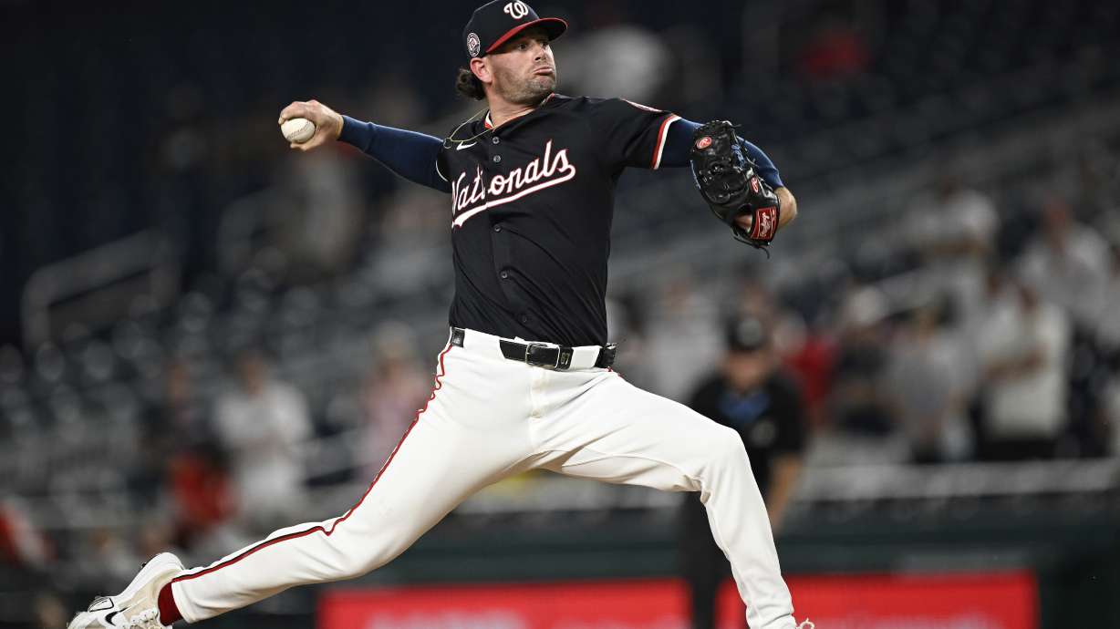 Washington Nationals pitcher Kyle Finnegan throws during the ninth inning of a baseball game against the Cincinnati Reds in Washington, Monday, July 21, 2025.
