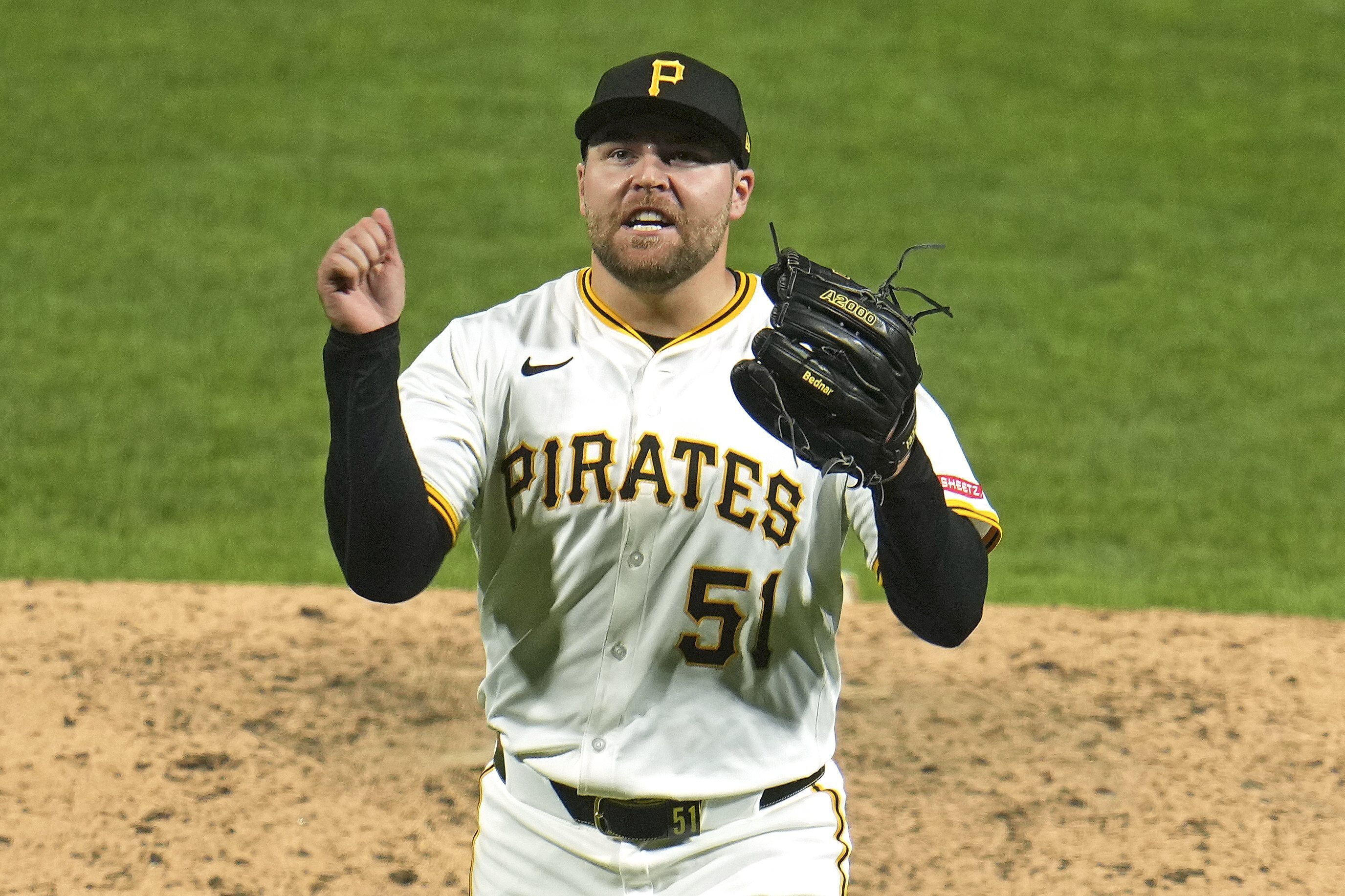 Pittsburgh Pirates pitcher David Bednar celebrates getting the final out of a baseball game against the Detroit Tigers in Pittsburgh, Tuesday, July 22, 2025. 