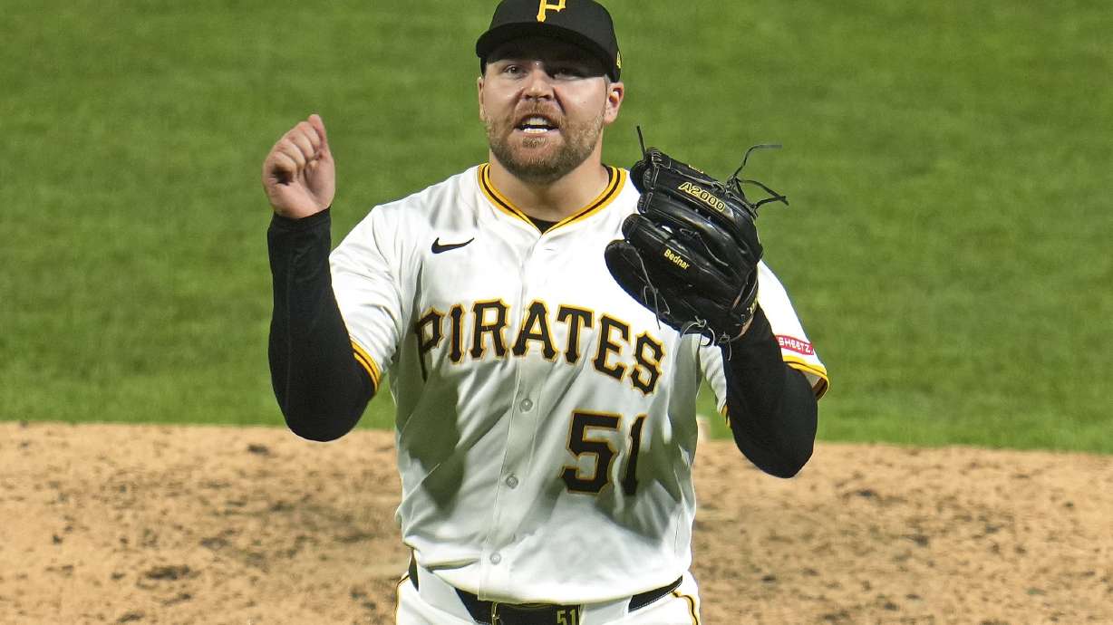 Pittsburgh Pirates pitcher David Bednar celebrates getting the final out of a baseball game against the Detroit Tigers in Pittsburgh, Tuesday, July 22, 2025.
