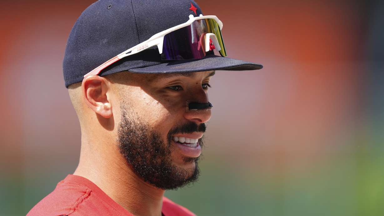 Minnesota Twins shortstop Carlos Correa warms up before a baseball game against the Colorado Rockies, Saturday, July 19, 2025, in Denver.