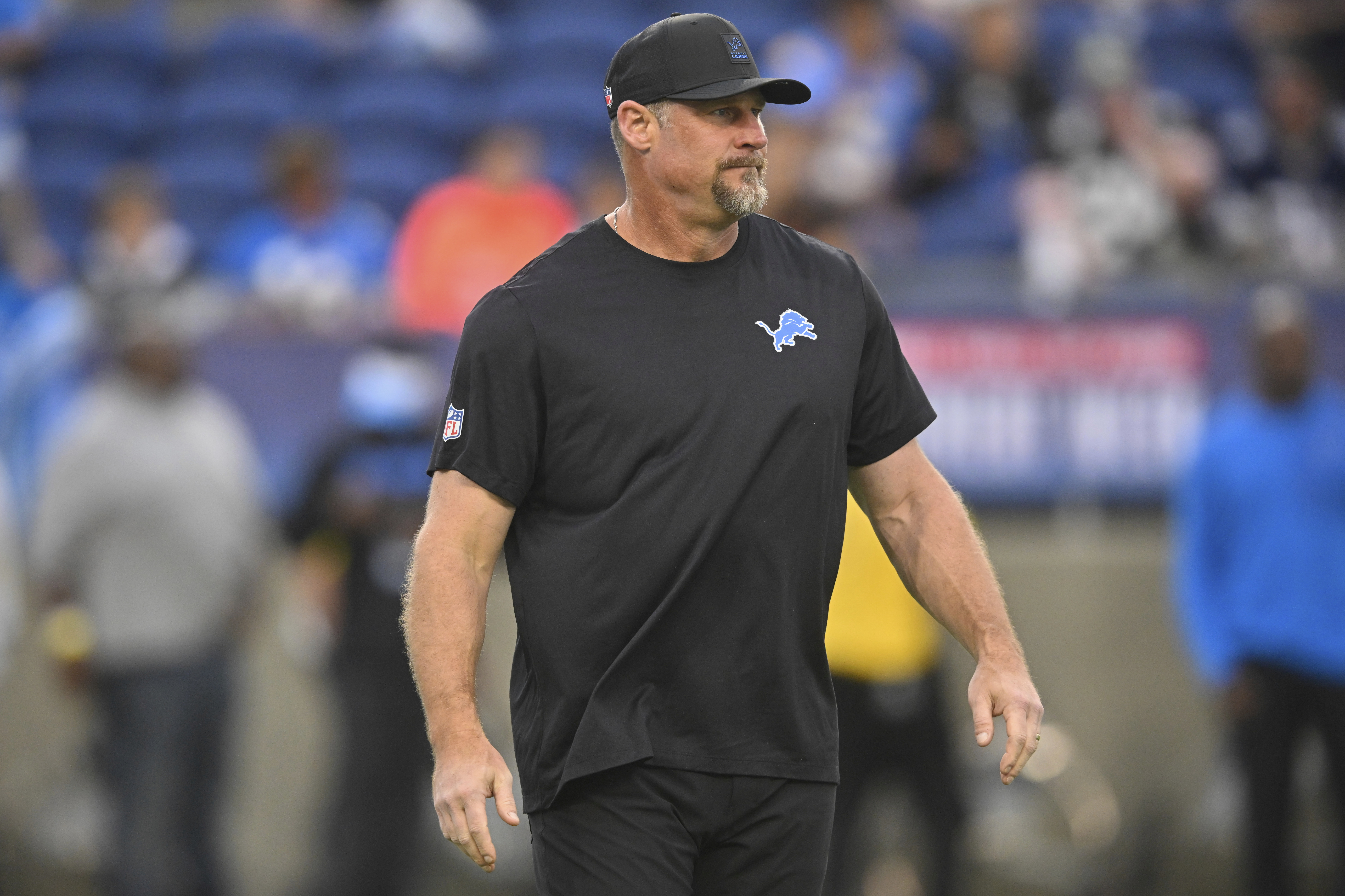 Detroit Lions head coach Dan Campbell watches during warm ups before the Pro Football Hall of Fame NFL preseason game between the Lions and the Los Angeles Chargers, Thursday, July 31, 2025, in Canton, Ohio.