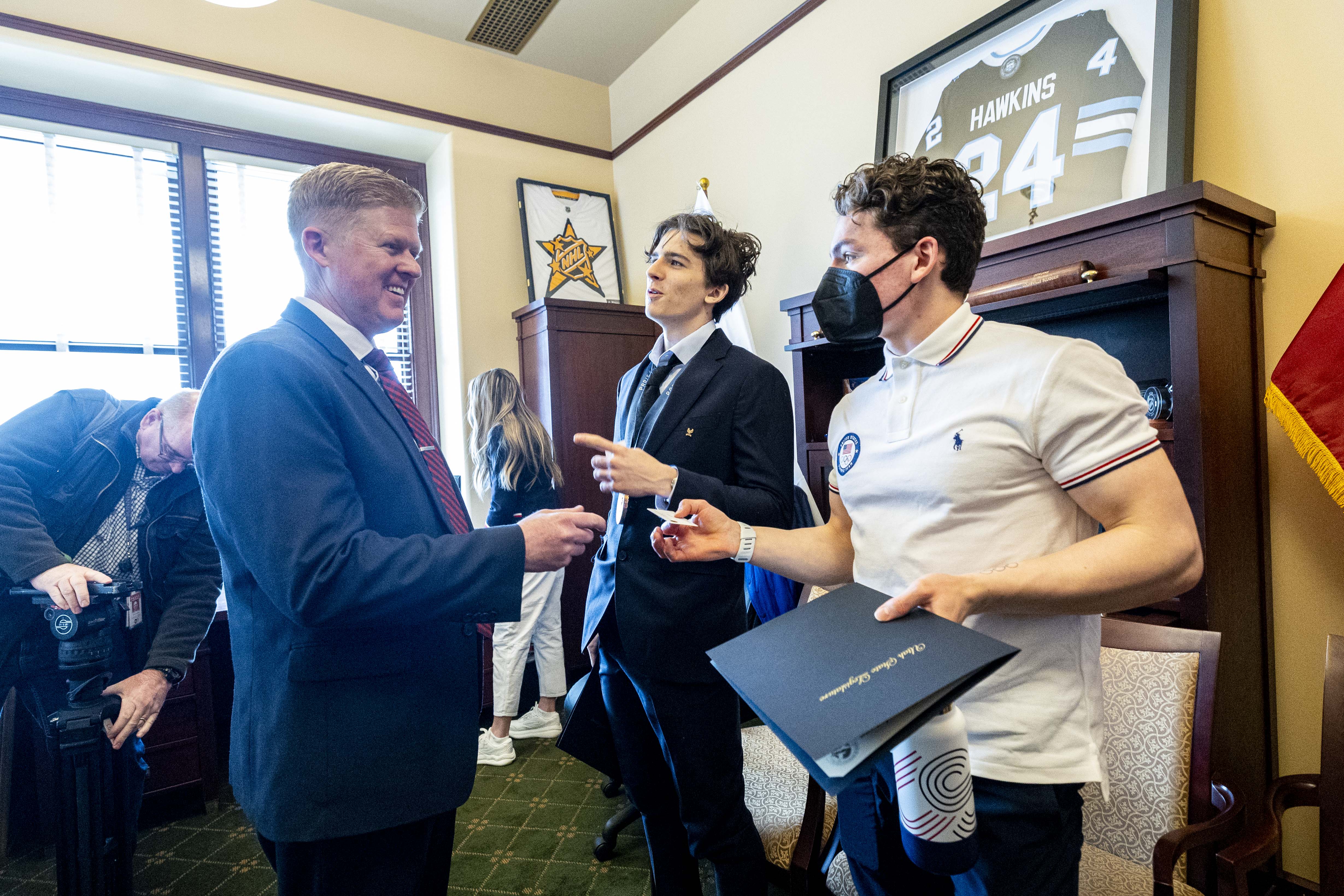 Rep. Jon Hawkins greets speed climbers Zach Hammer and Sam Watson in Hawkins’ office at the Capitol in Salt Lake City on Feb. 19. Hawkins is the Olympics' legislative committee House chairman.