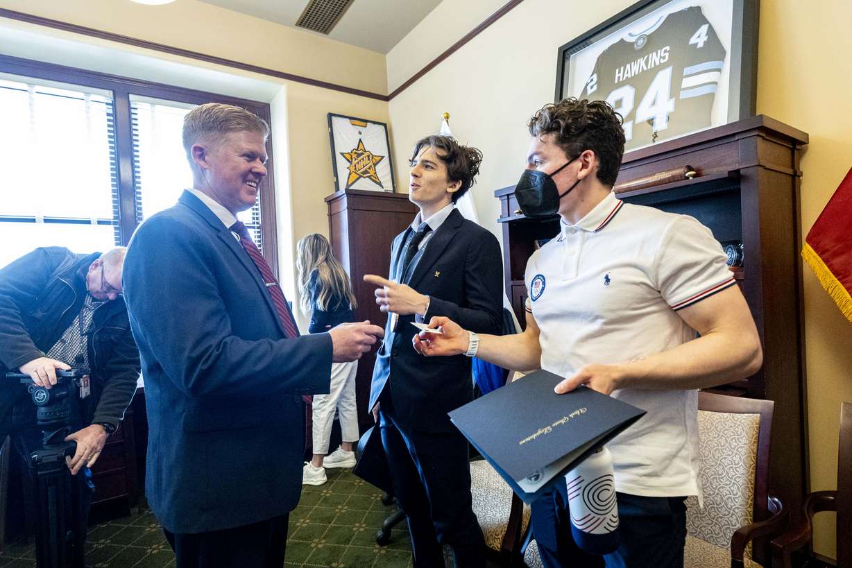Rep. Jon Hawkins greets speed climbers Zach Hammer and Sam Watson in Hawkins’ office at the Capitol in Salt Lake City on Feb. 19. Hawkins is the Olympics' legislative committee House chairman.
