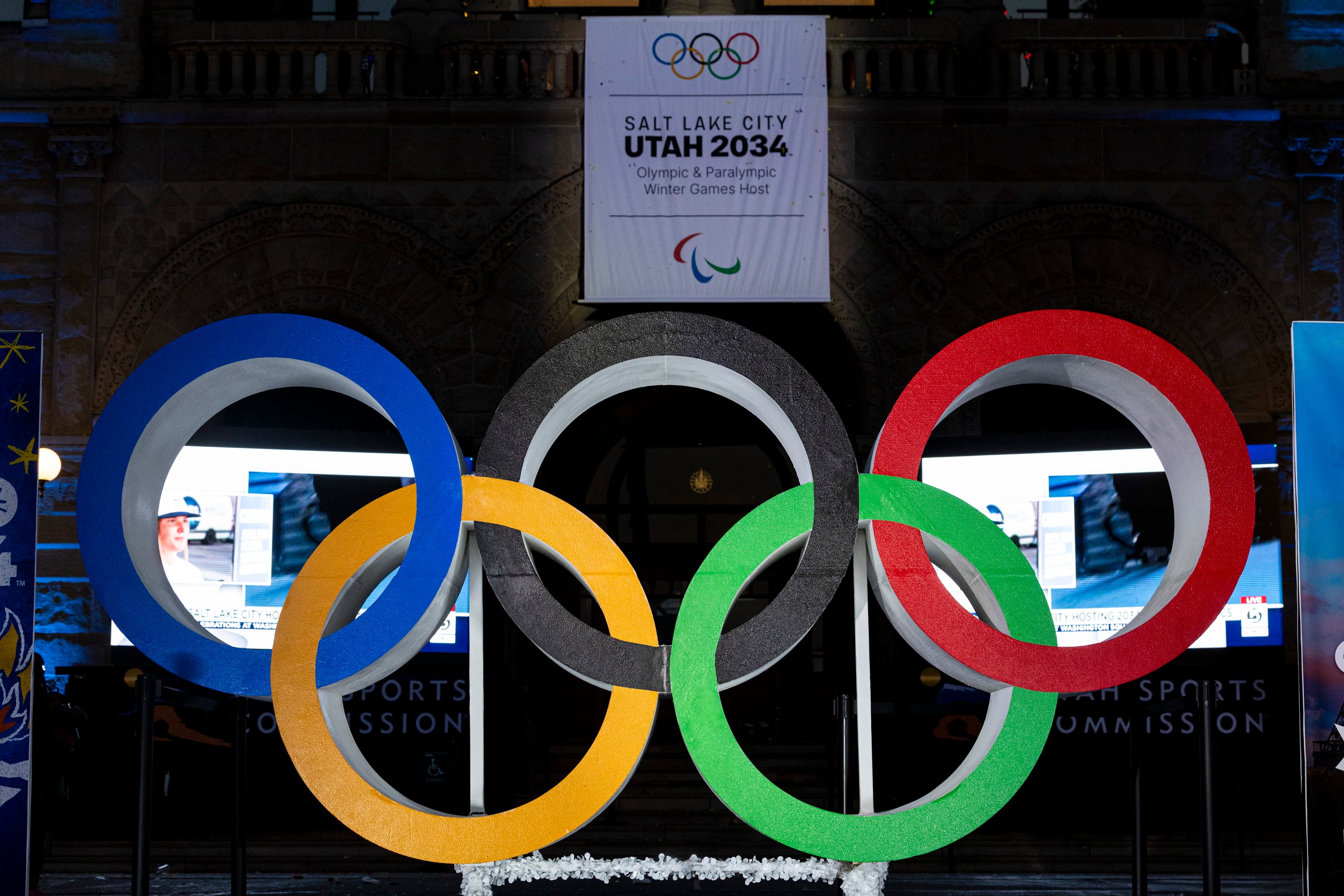 The Olympic rings and bid banner at Washington Square Park on July 24, 2024, in downtown Salt Lake City. The legislative committee will take on a coordination role, Rep. Jon Hawkins said Thursday.