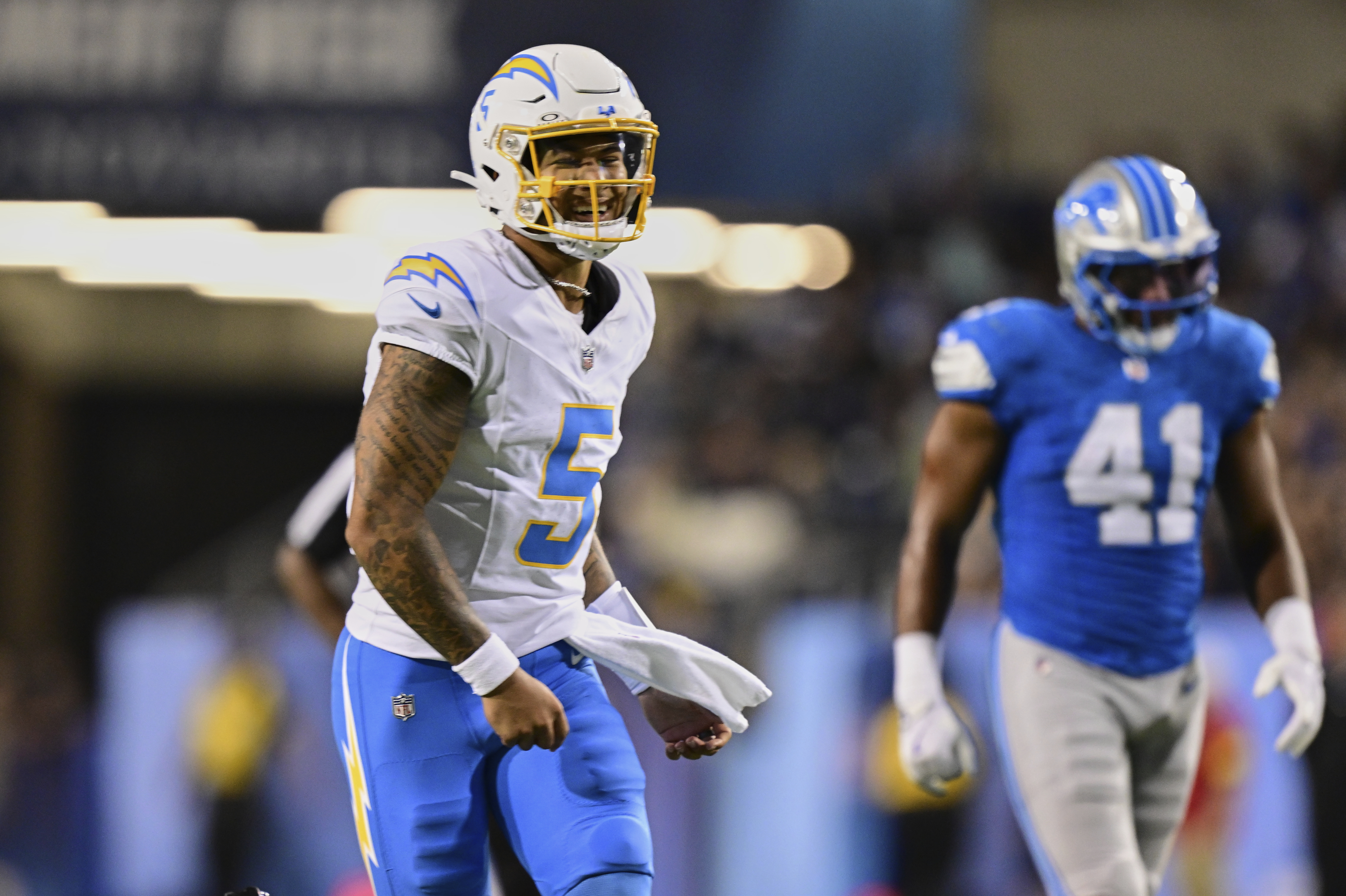 Los Angeles Chargers quarterback Trey Lance (5) celebrates his touchdown pass to KeAndre Lambert-Smith in the first half of the Pro Football Hall of Fame NFL preseason game Thursday, July 31, 2025, in Canton, Ohio.