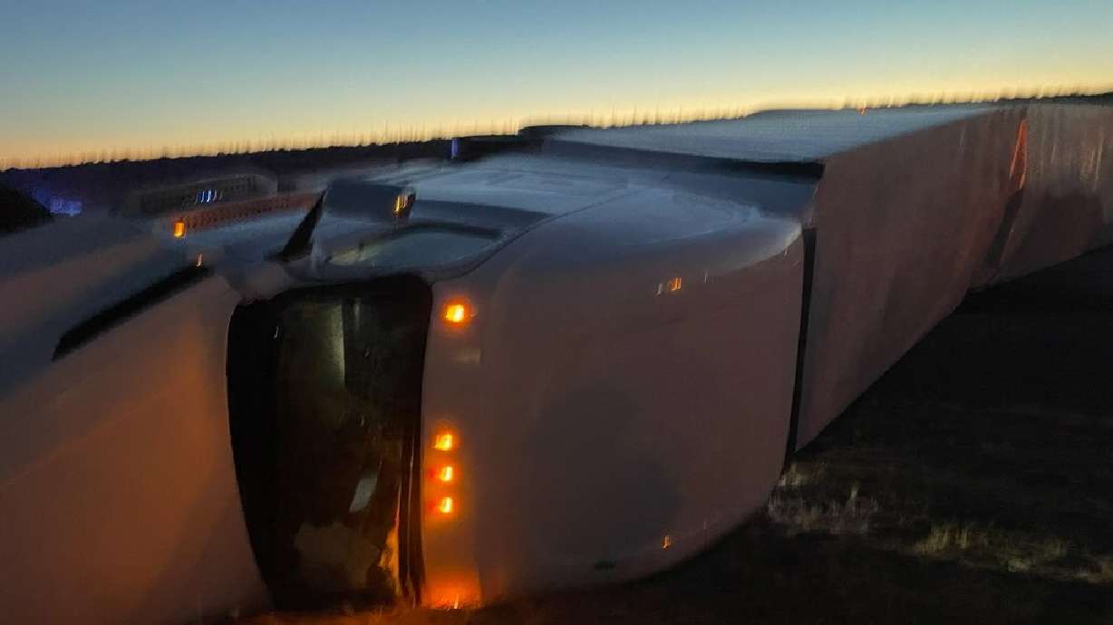 A semitruck carrying 12,000 pounds of empty food containers rolled on I-15 in Millard County on Thursday night, temmporarily blocking all lanes of northbound traffic on the highway.