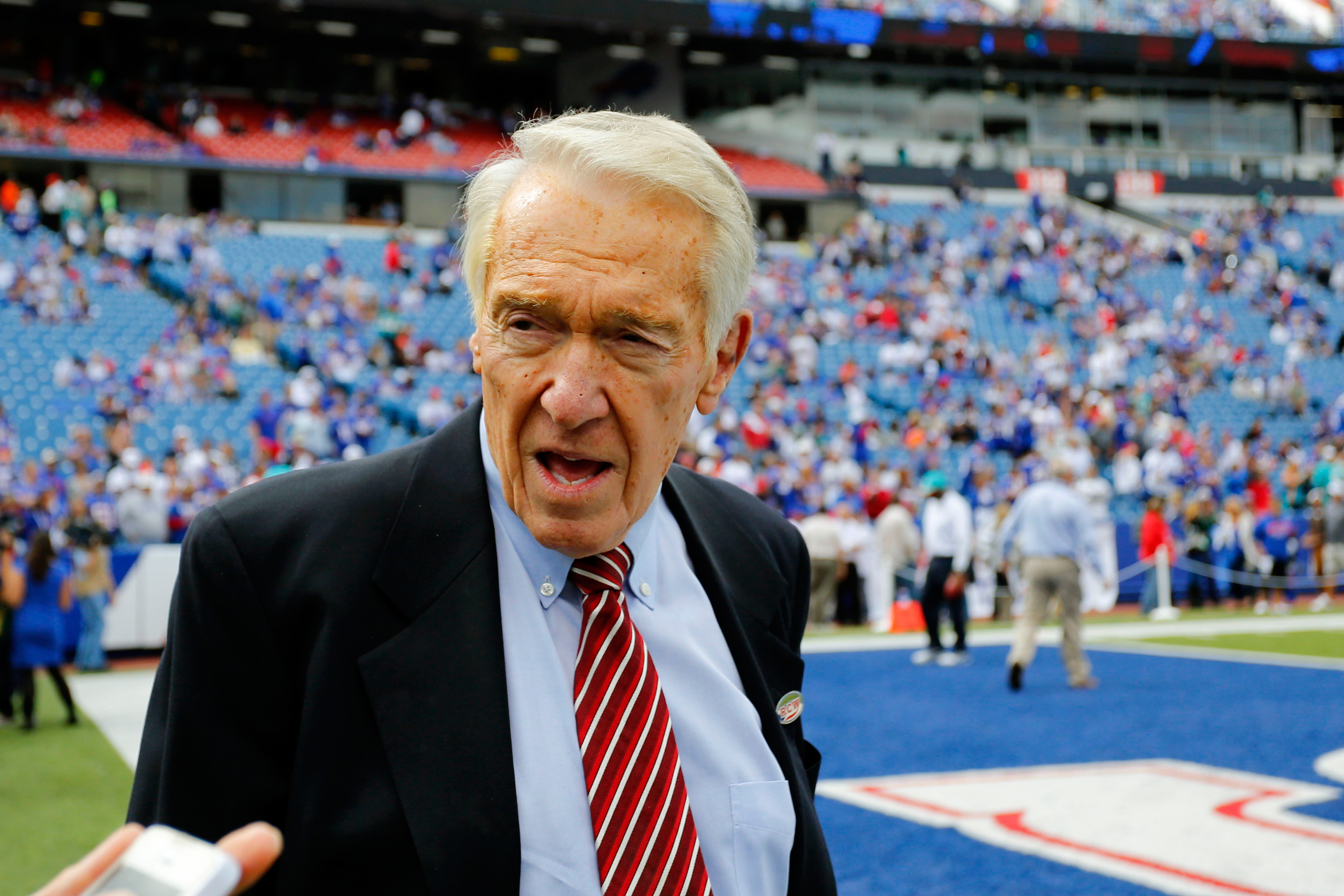 FILE - Buffalo Bills Hall of Fame coach Marv Levy walks on the field during warm ups before an NFL football game between the Buffalo Bills and the Miami Dolphins on Sept. 14, 2014, in Orchard Park, N.Y.