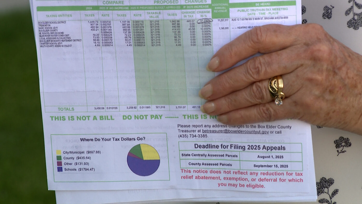 Kristie Bowcutt holds her Box Elder County tax notice on Thursday, July 31, 2025.