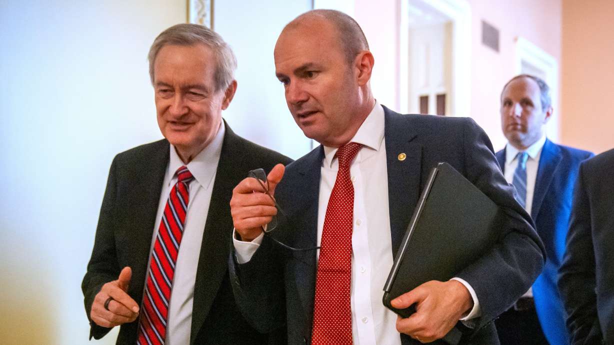 Sen. Mike Crapo, R-Idaho, left, and Sen. Mike Lee, R-Utah, July 16 in Washington. Lee introduced legislation Thursday that would give President Donald Trump the power to appoint interim judges while his nominees are vetted by the Senate.