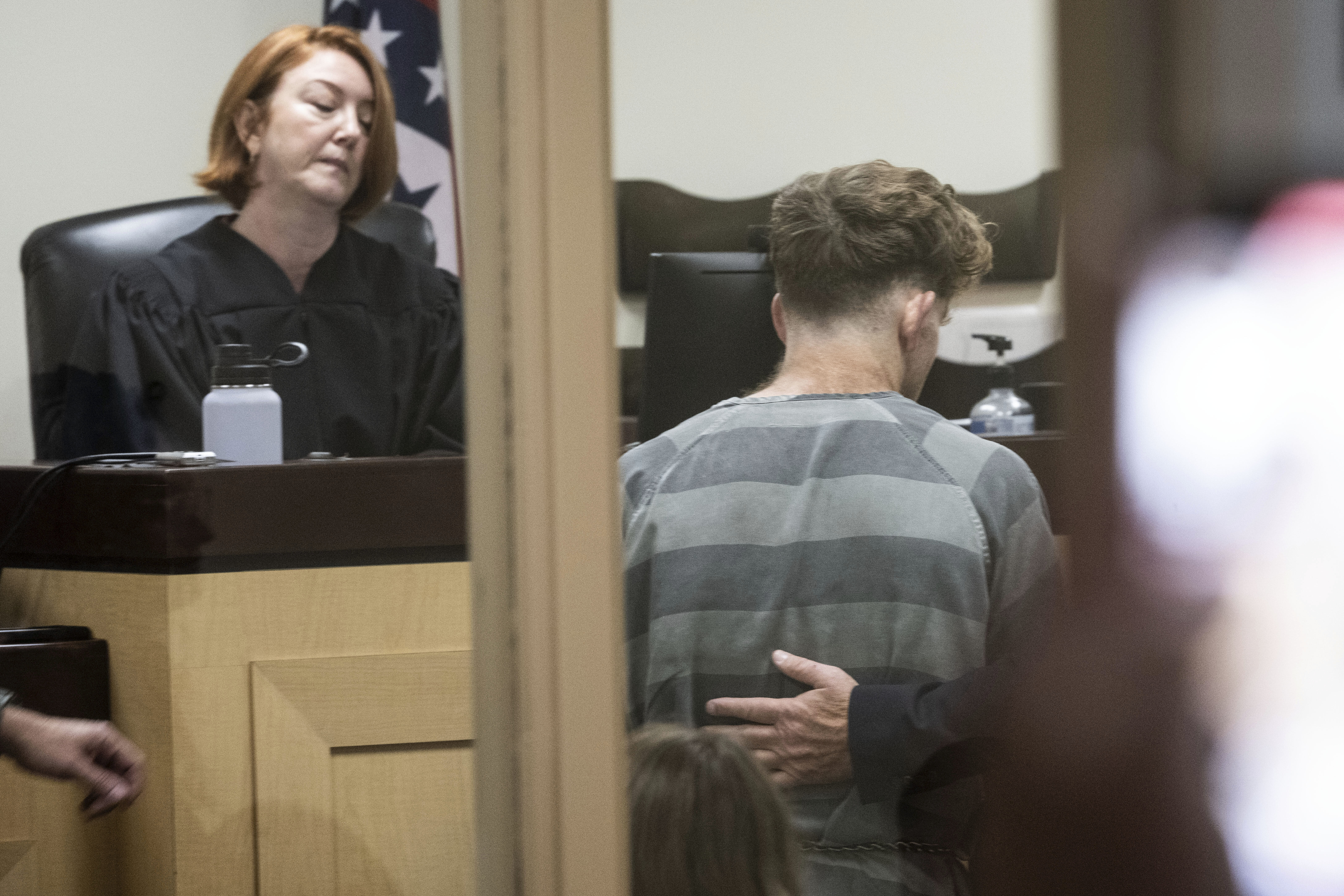 Teacher charged in fatal stabbing of couple on a hike with their kids is ordered held without bond