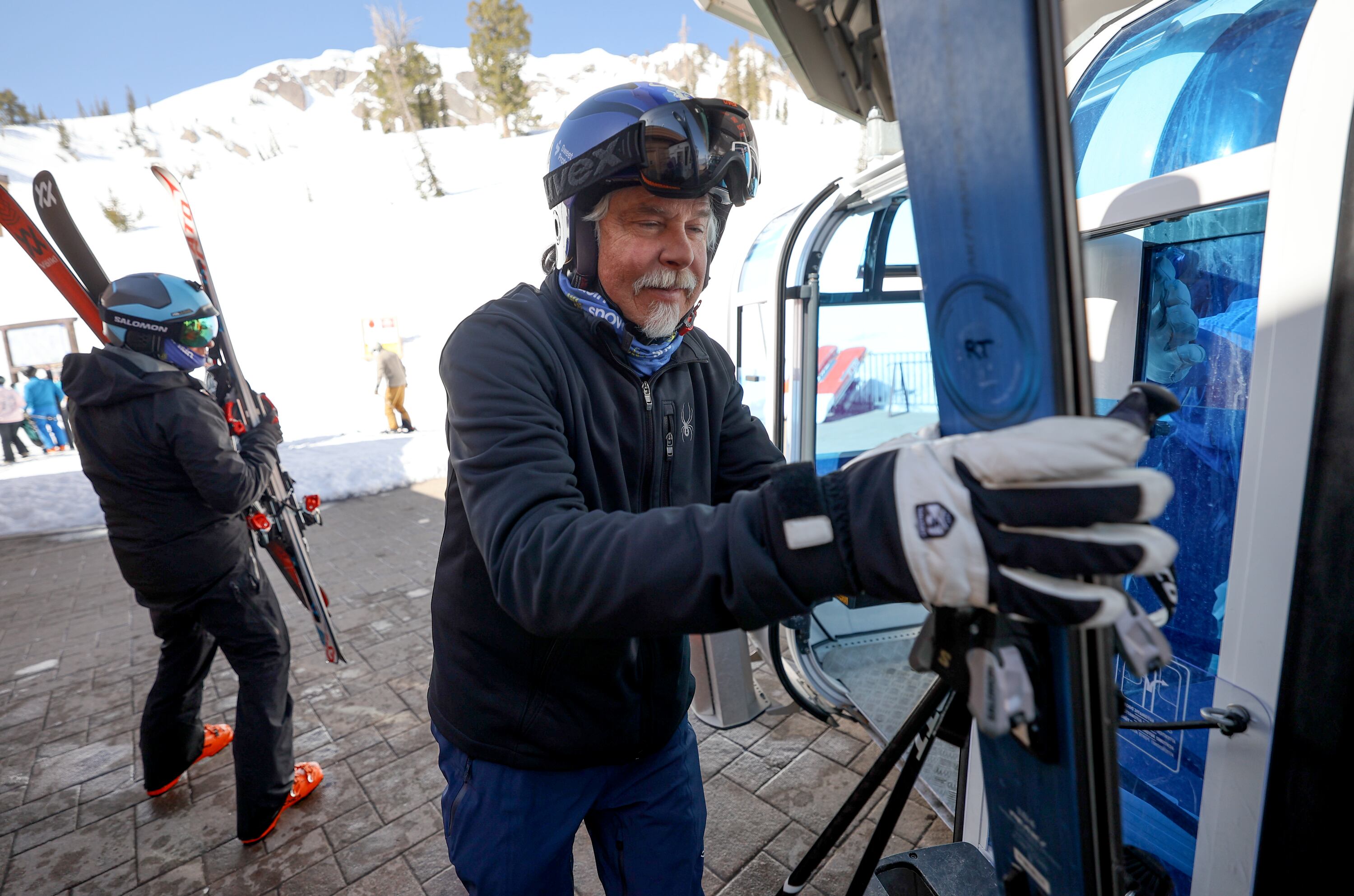 Tom Hart grabs his skies from the Needles gondola at Snowbasin Resort in Weber County on April 10. Hart recently set the Guinness World Record for greatest vertical distance skied in a year.