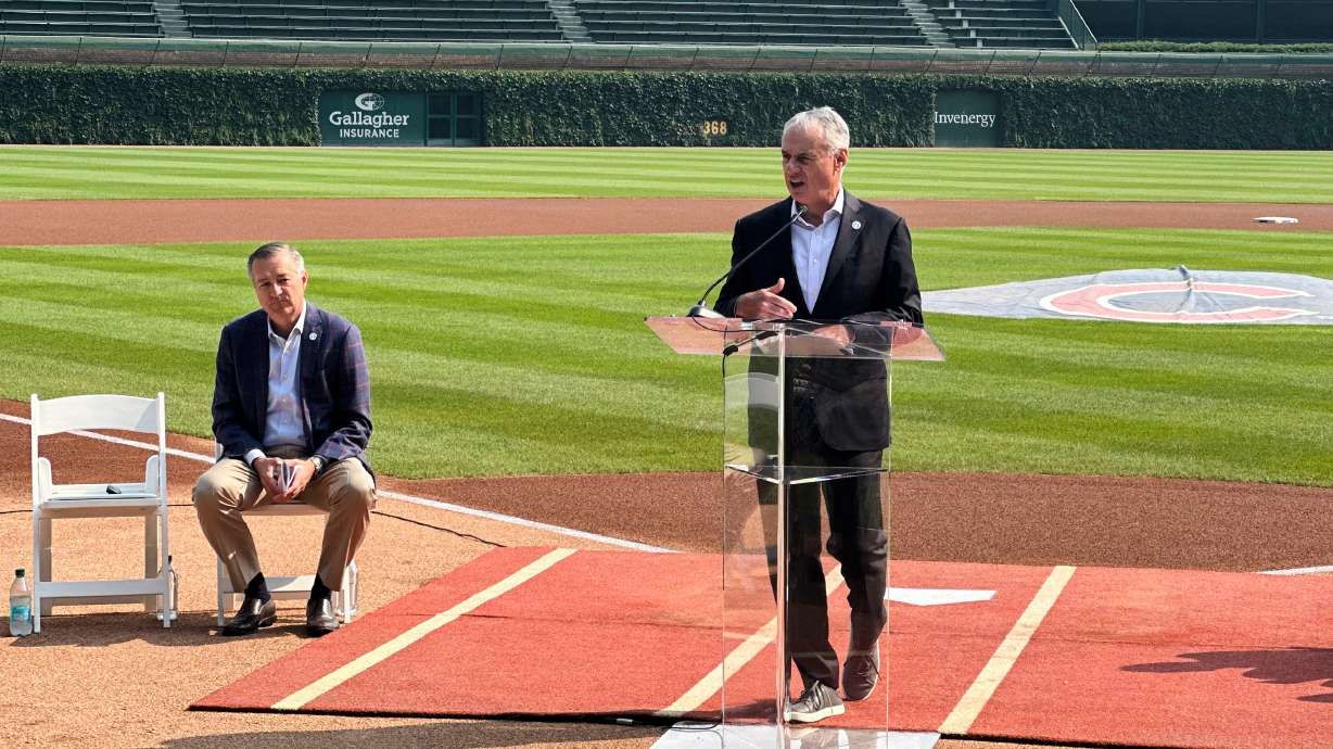 MLB commissioner Rob Manfred announces that Wrigley Field will host the 2027 All-Star Game as Chicago Cubs chairman Tom Ricketts looks on during a baseball news conference Friday, Aug. 1, 2025, in Chicago.