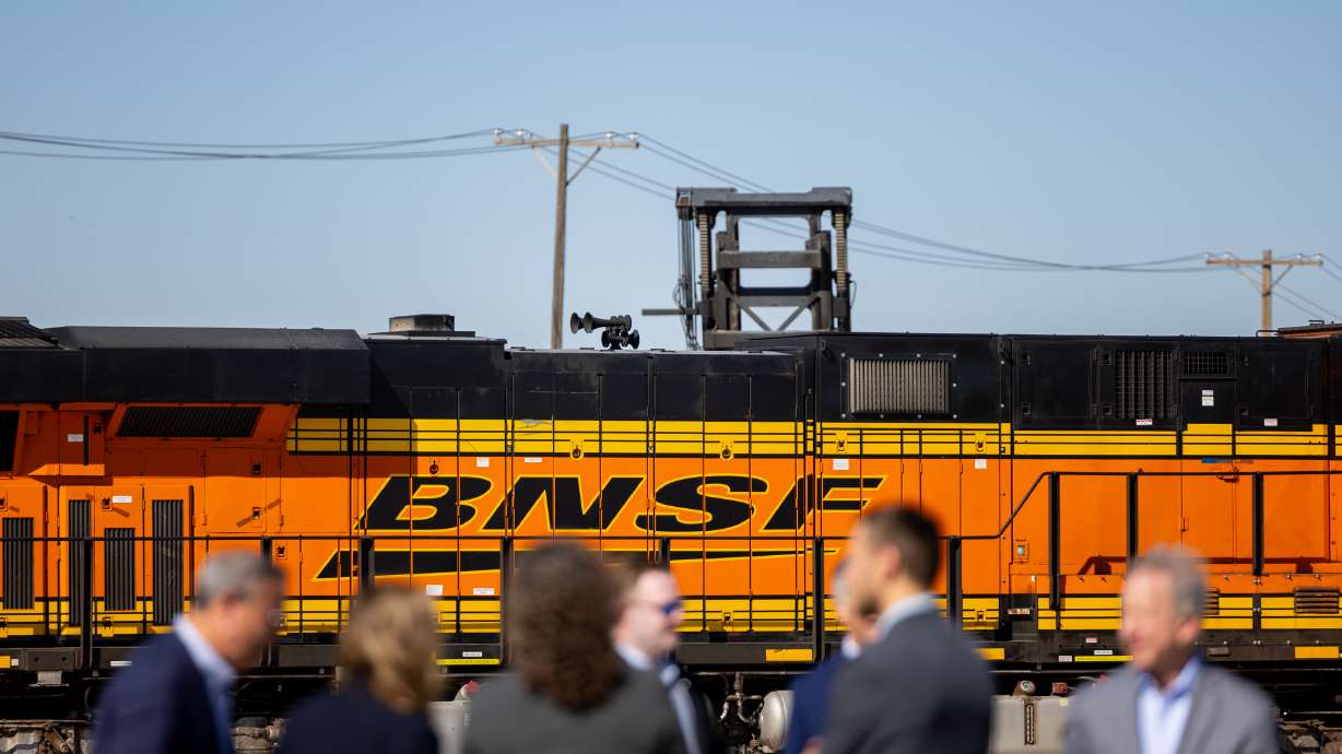 People talk after BNSF Railway, Patriot Rail and the Utah Inland Port Authority hosted a ribbon cutting to mark the official opening of BNSF’s new intermodal facility, a 43-acre site located 5 miles from Salt Lake City International Airport, Thursday.