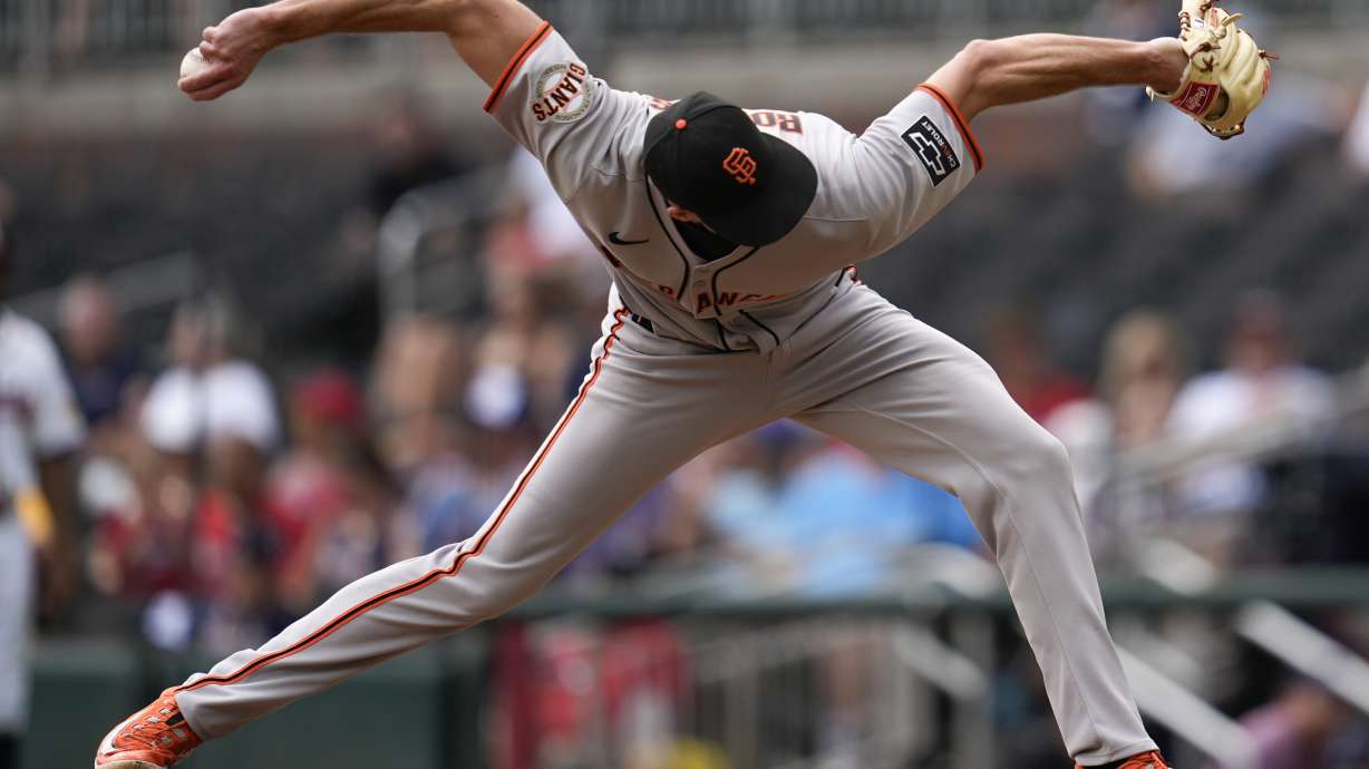 San Francisco Giants pitcher Tyler Rogers (71) delivers in the ninth inning of a baseball game against the Atlanta Braves, Wednesday, July 23, 2025, in Atlanta.