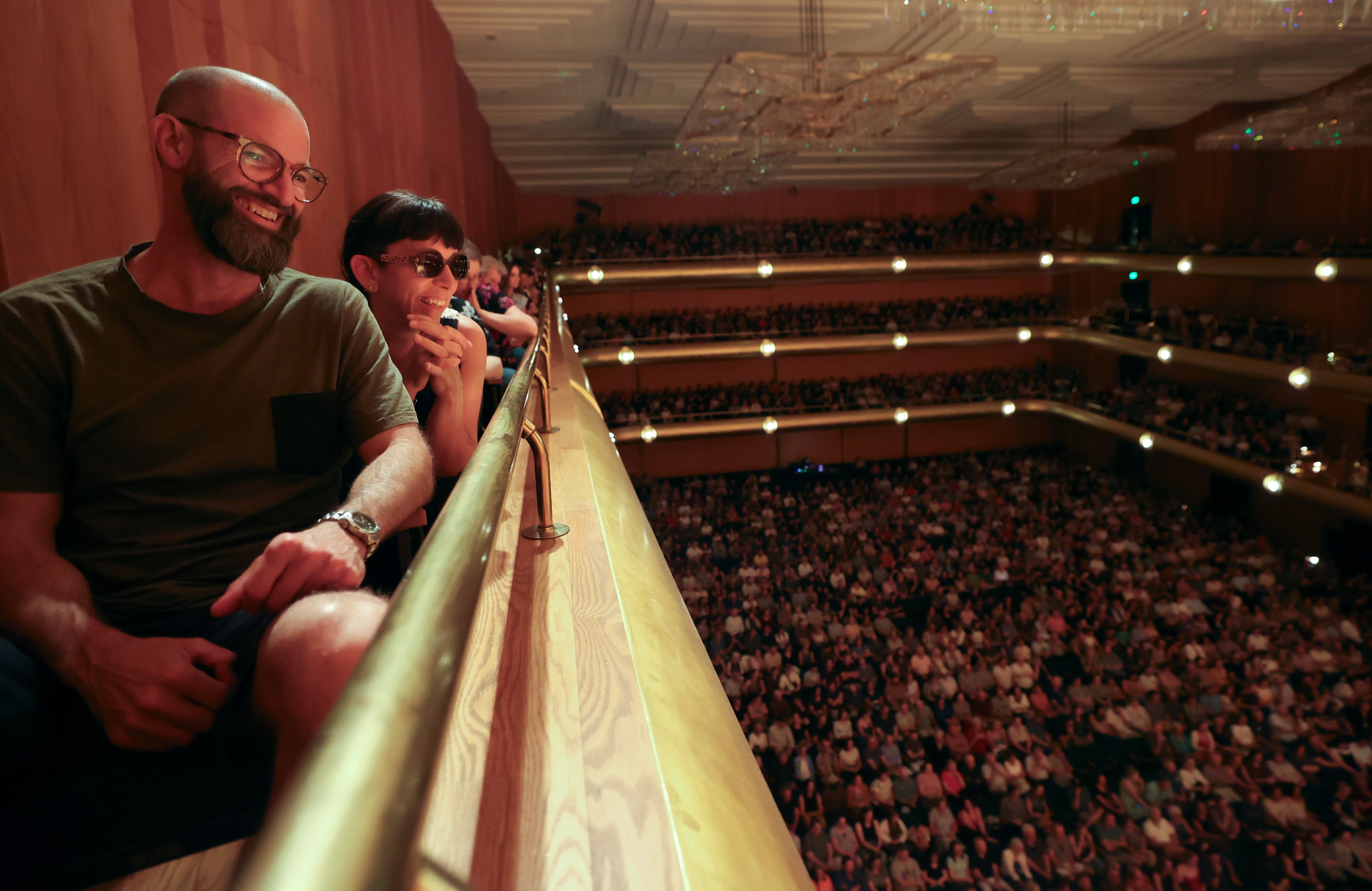 Jason Beck and Tina Ziemek laugh during a recording of the NPR news game show "Wait Wait... Don’t Tell Me!" at Abravanel Hall in Salt Lake City on Thursday. The show was sold out.