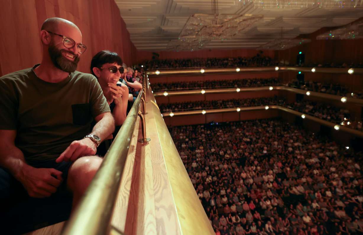 Jason Beck and Tina Ziemek laugh during a recording of the NPR news game show "Wait Wait... Don’t Tell Me!" at Abravanel Hall in Salt Lake City on Thursday. The show was sold out.