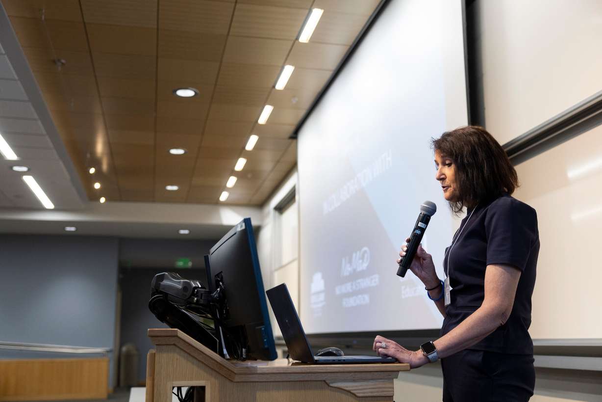 Carolyn Andrews, the associate dean of BYU Continuing Education, helps announce a partnership between the BYU Law School and "No More A Stranger" legal services to develop an immigration law course for students outside the legal profession during an event celebrating the fifth anniversary of NOMAS at the BYU Salt Lake Center in Salt Lake City on Thursday.