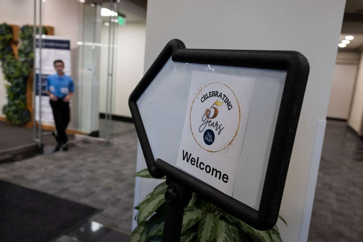 A sign directs attendees toward an event celebrating the fifth year of “No More a Stranger” at the BYU Salt Lake Center in Salt Lake City on Thursday.