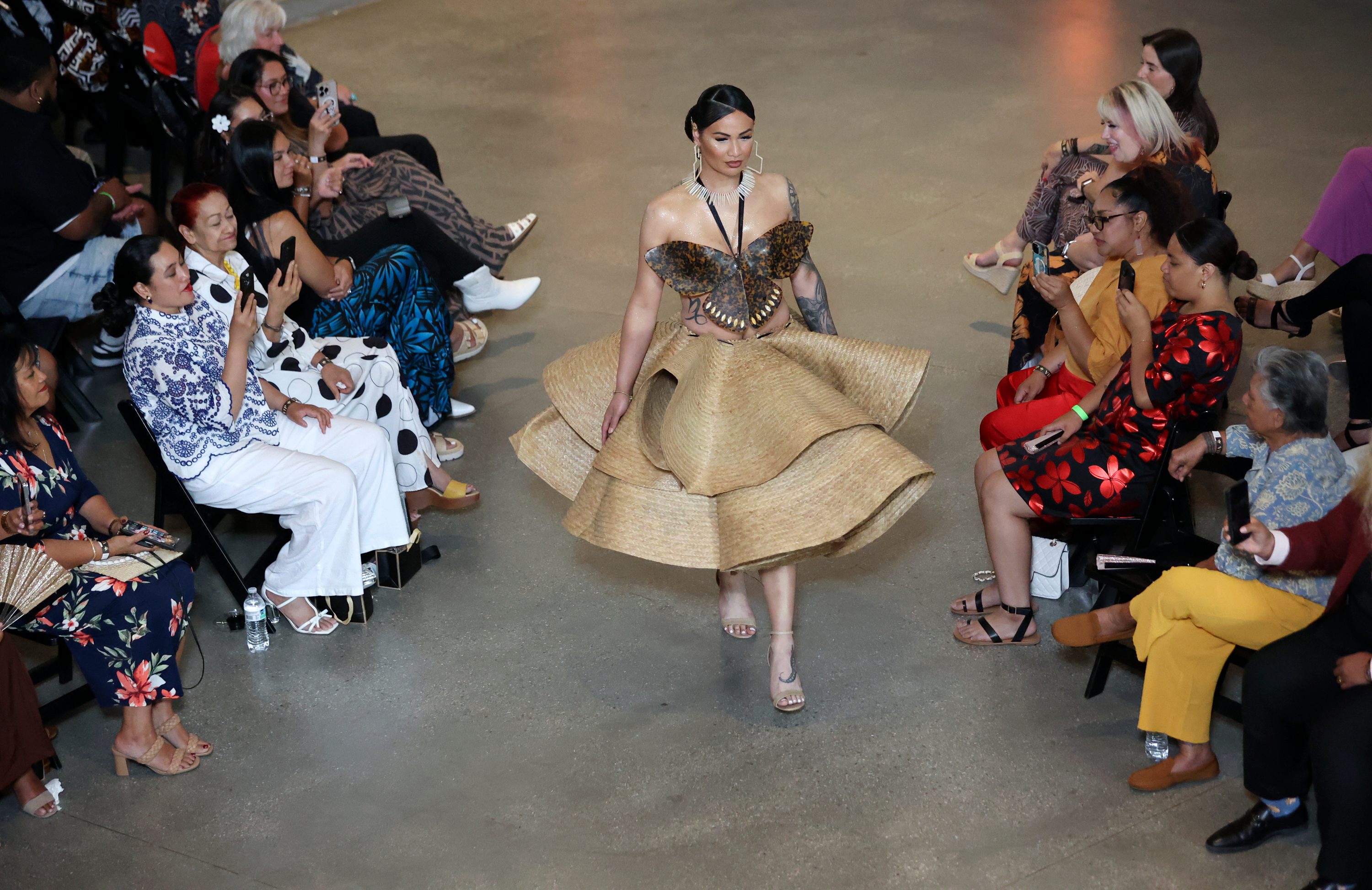 A model wears Rockin Roquin during a Creative Pacific fashion show in Salt Lake City Friday. The show also honored designer Afa Ah Loo, an innocent bystander shot and killed at a No Kings protest, and showcased his designs finished after his death.