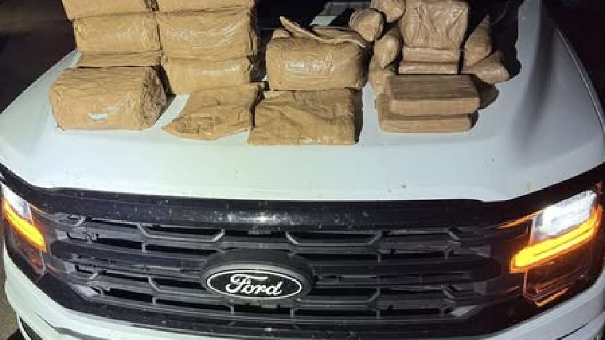 The hood of a San Juan police vehicle is covered with narcotics seized early Saturday. The drugs, with a street value of $1.2 million, were discovered in a vehicle by a K-9 unit after the driver was pulled over in Blanding.