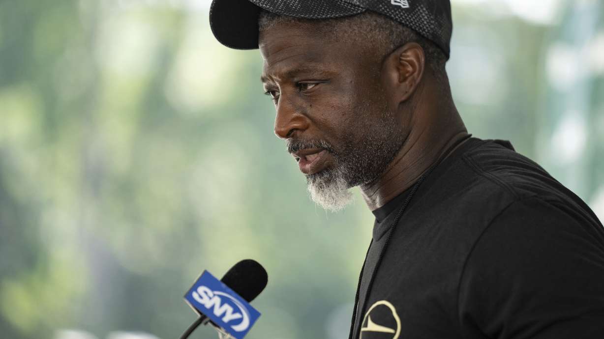 New York Jets head coach Aaron Glenn speaks at a press conference following practice at the team's NFL football training camp, Saturday, July 26, 2025, in Florham Park, N.J.