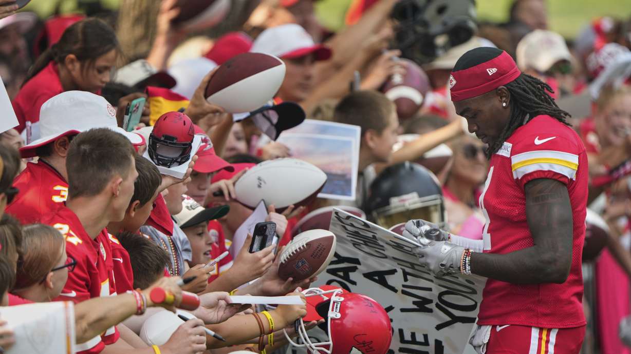 Kansas City Chiefs wide receiver Rashee Rice signs autographs at NFL football training camp Friday, Aug. 1, 2025, in St. Joseph, Mo.