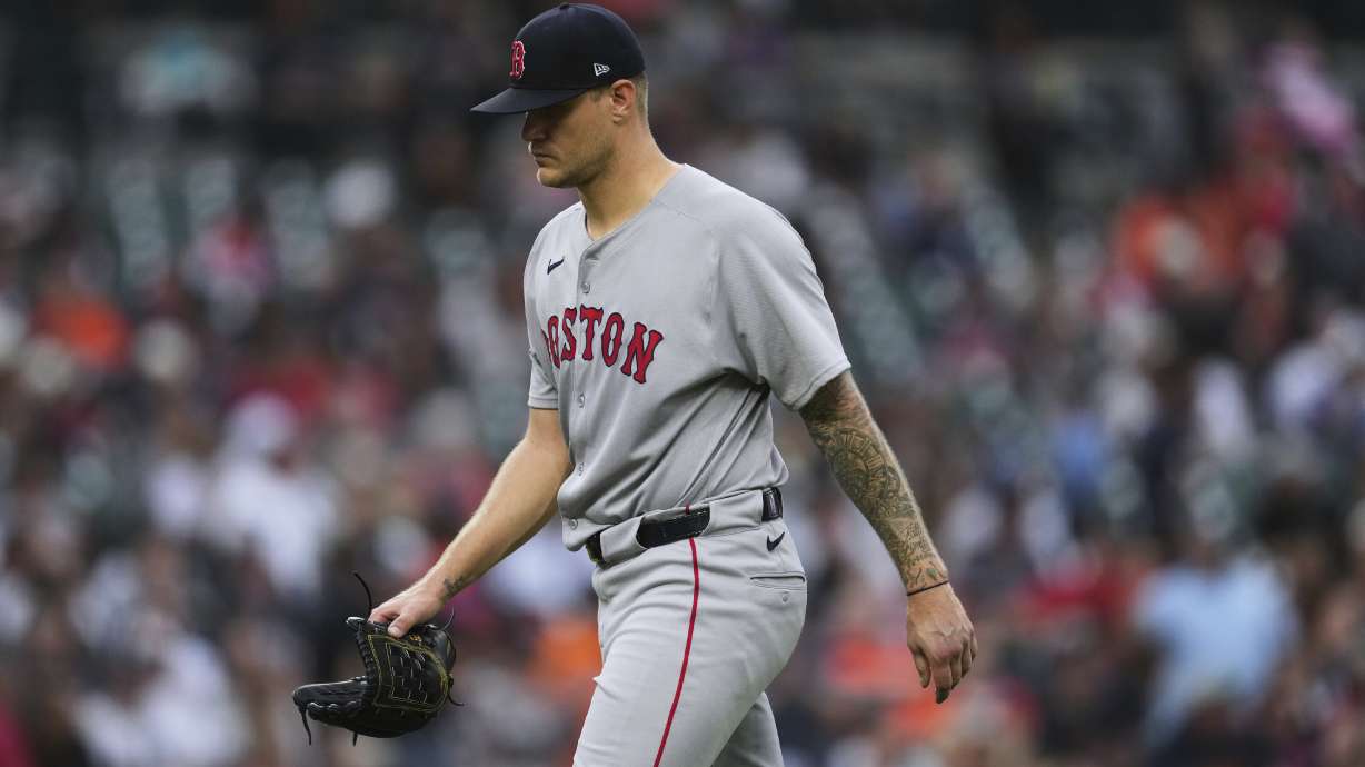 FILE - Boston Red Sox pitcher Tanner Houck walks to the dugout after being pulled against the Detroit Tigers in the third inning during a baseball game, May 12, 2025, in Detroit.