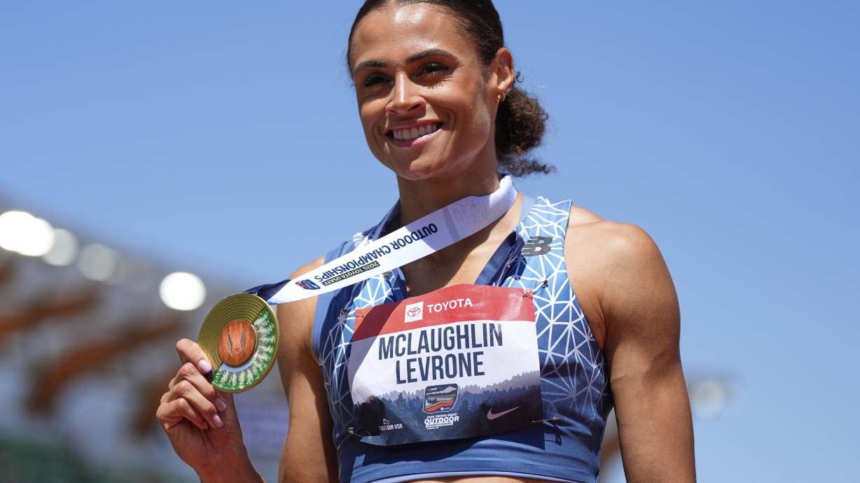 Sydney McLaughlin-Levrone shows her gold medal after winning the women's 400-meter finals during the U.S. Championships athletics meet in Eugene, Ore.,Saturday, Aug. 2, 2025.
