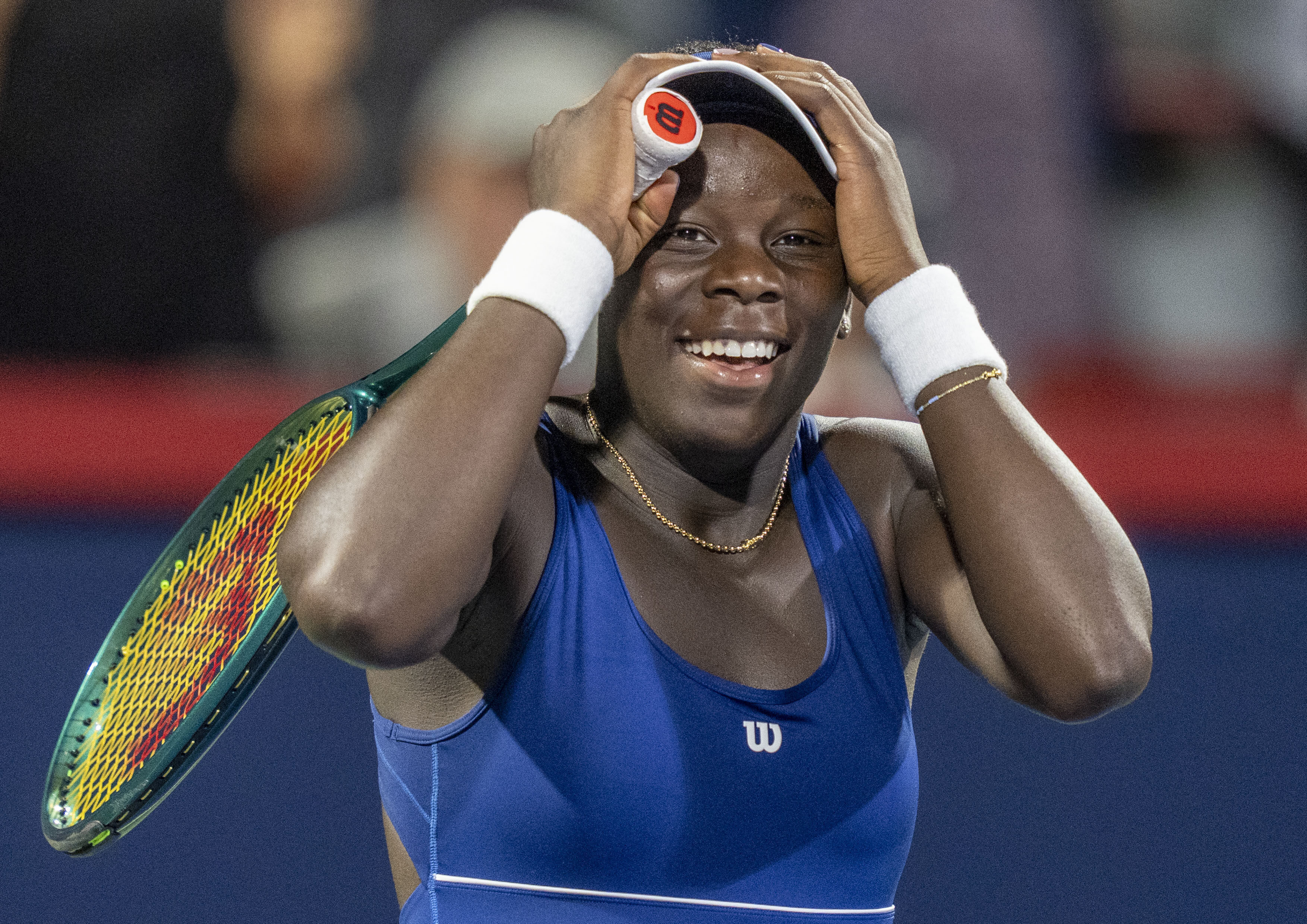 Victoria Mboko, of Canada, celebrates after her win over Marie Bouzkova, of Czechia, during third-round match action at the National Bank Open women's tennis tournament in Montreal, Thursday, July 31, 2025.