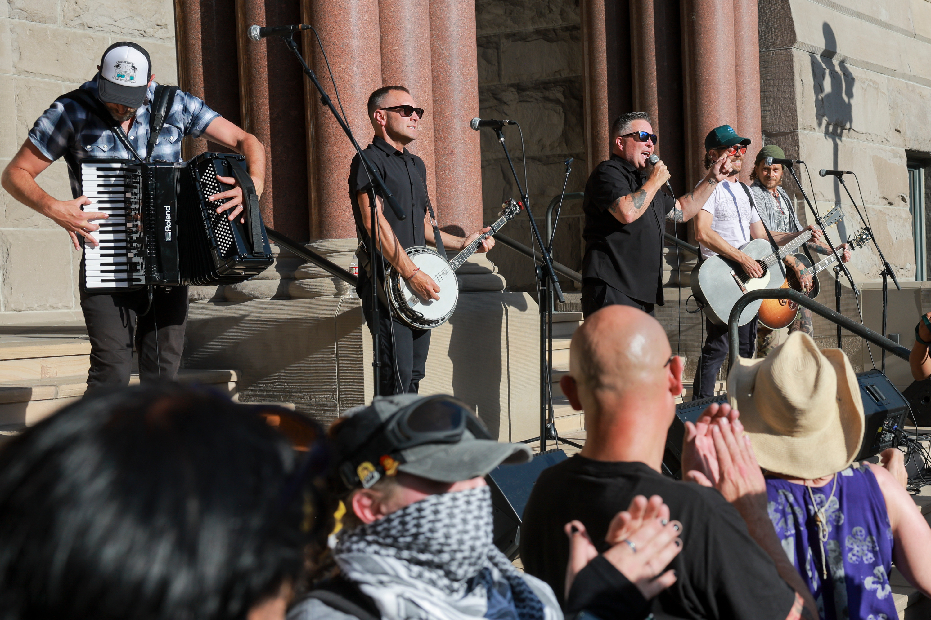 The Dropkick Murphys perform during a Rage Against the Regime rally at Washington Square in Salt Lake City on Saturday.