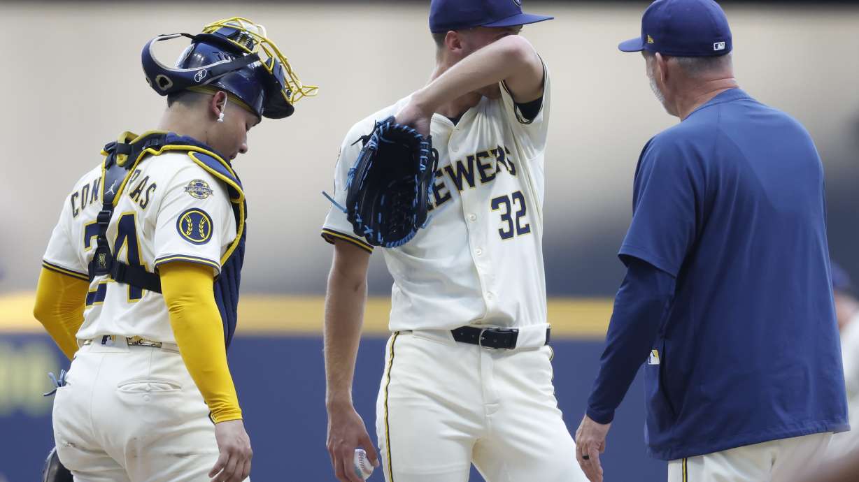 Milwaukee Brewers pitcher Jacob Misiorowski (32) wipes his face during a break in the action against the Chicago Cubs during the first inning of a baseball game, Monday, July 28, 2025, in Milwaukee.