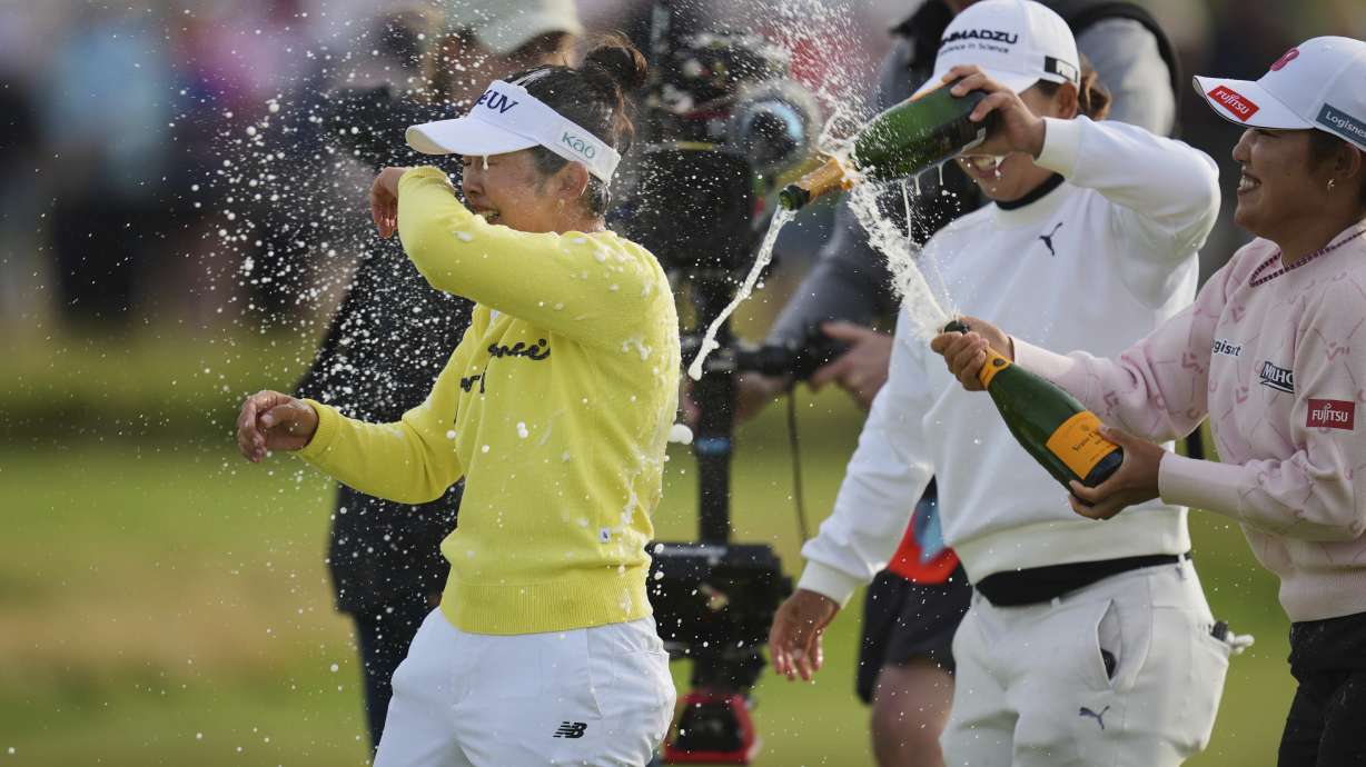 Miyu Yamashita, left, of Japan celebrates after winning the Women's British Open golf championship, at Royal Porthcawl Golf Club in Porthcawl, Wales, Sunday, Aug. 3, 2025.