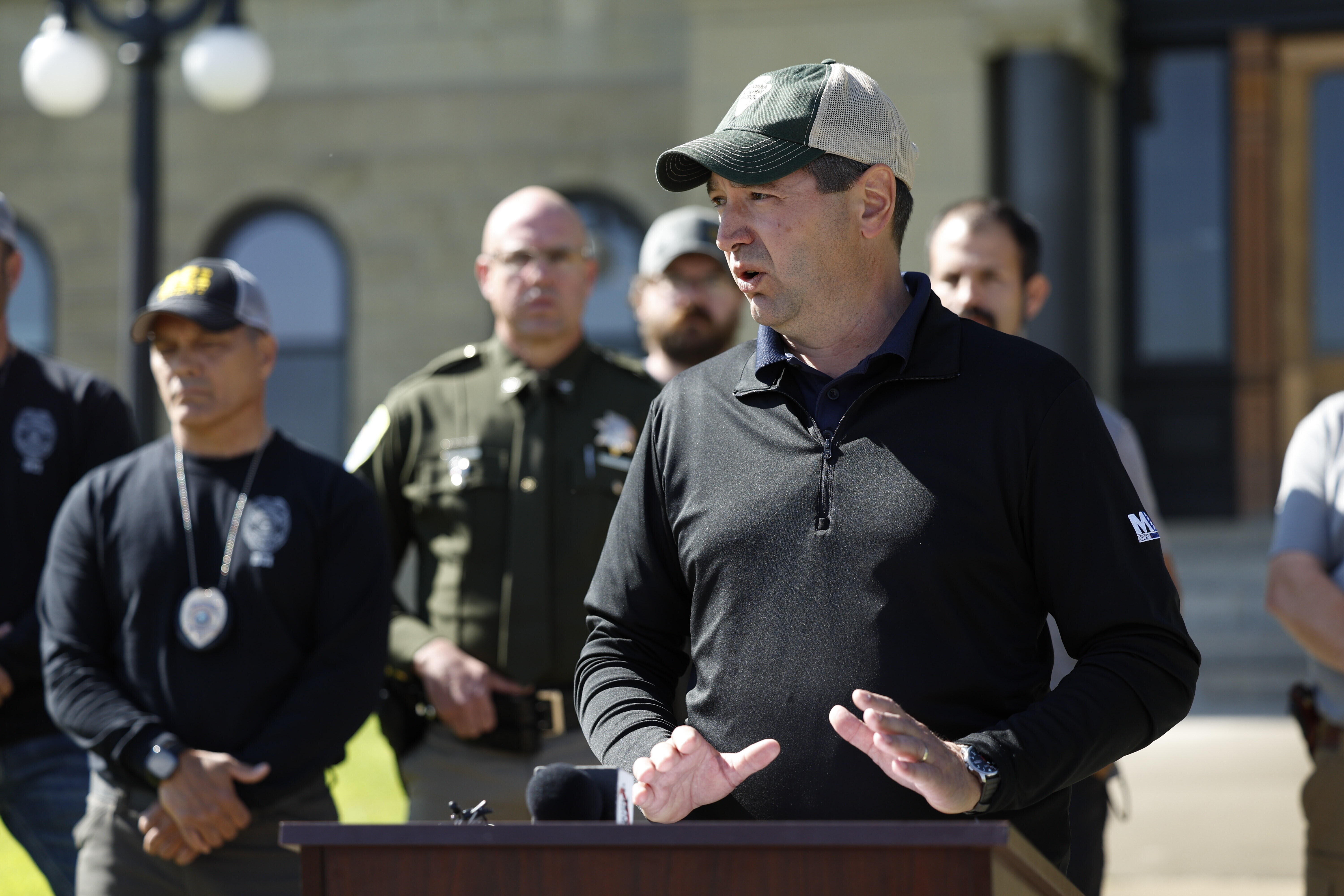 Montana Attorney General Austin Knudsen speaks to the media Sunday, in front of the Anaconda-Deer Lodge County Courthouse in Anaconda, Mont., about the ongoing search for shooting suspect Michael Brown.
