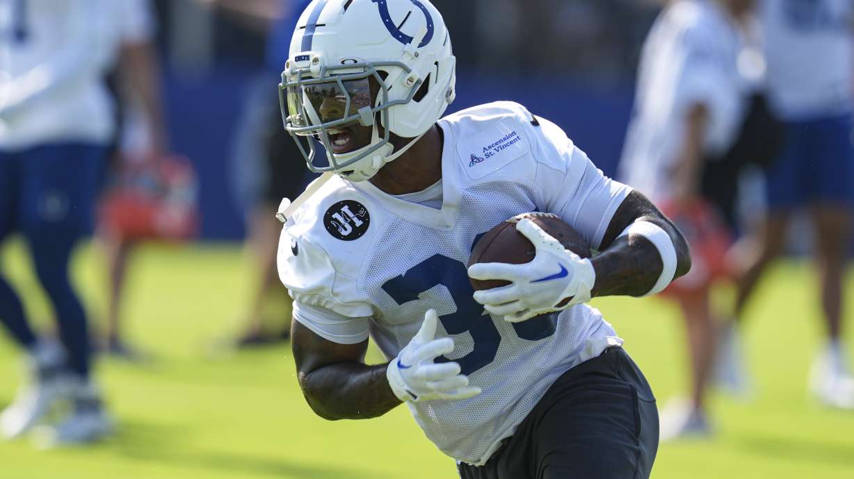 FILE - Indianapolis Colts running back Salvon Ahmed (36) runs a drill during practice at the NFL football team's training camp in Westfield, Ind., July 23, 2025.