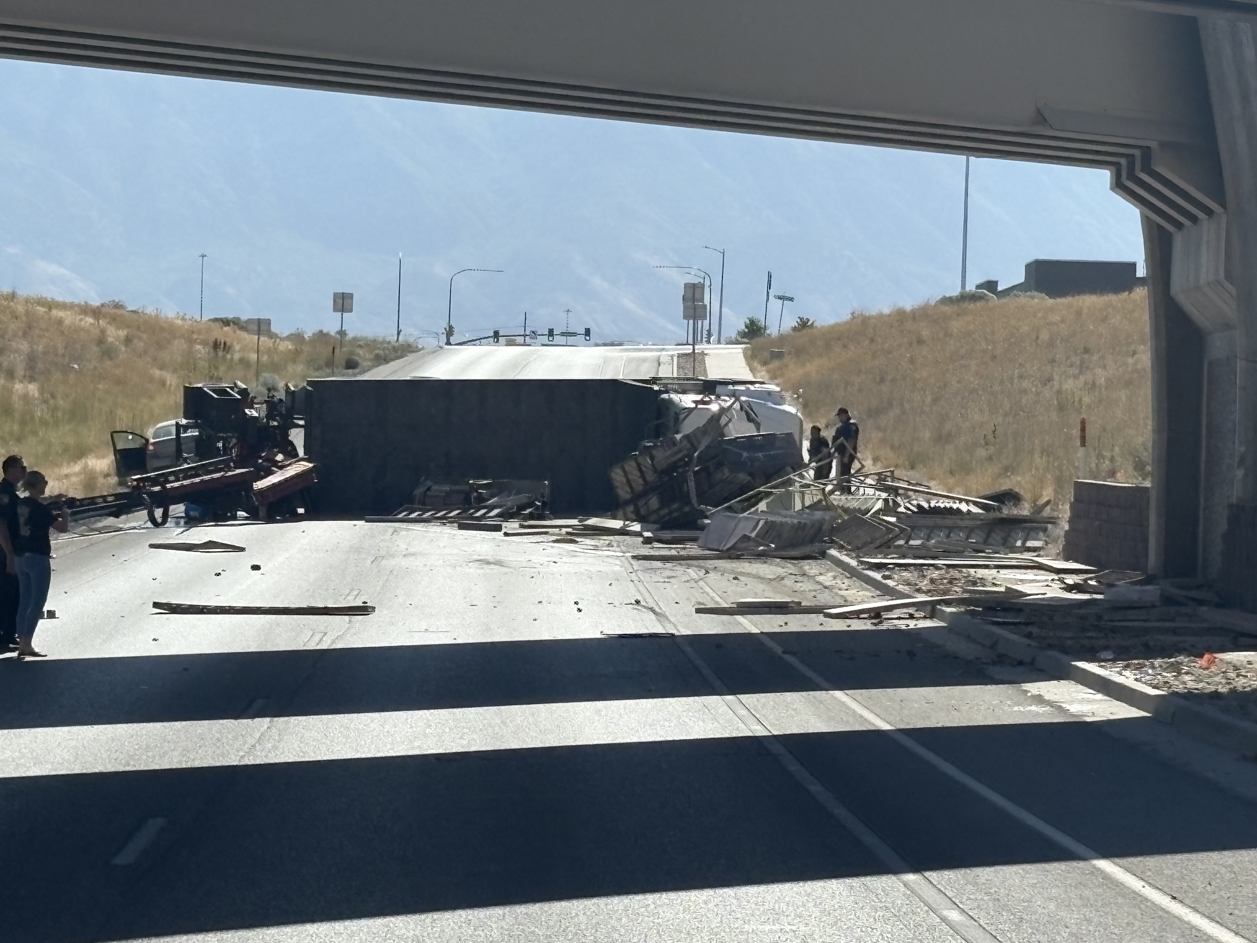One person died Sunday in a Lehi rollover that closed traffic for six hours. A cement form truck with a crane mounted on the back struck a UTA bridge with its crane arm, a city spokesperson said.