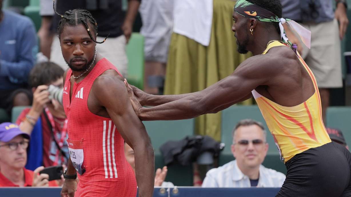 Kenny Bednarek pushes Noah Lyles after the men's 200-meter finals during the U.S. Championships athletics meet in Eugene, Ore.,Sunday, Aug. 3, 2025.